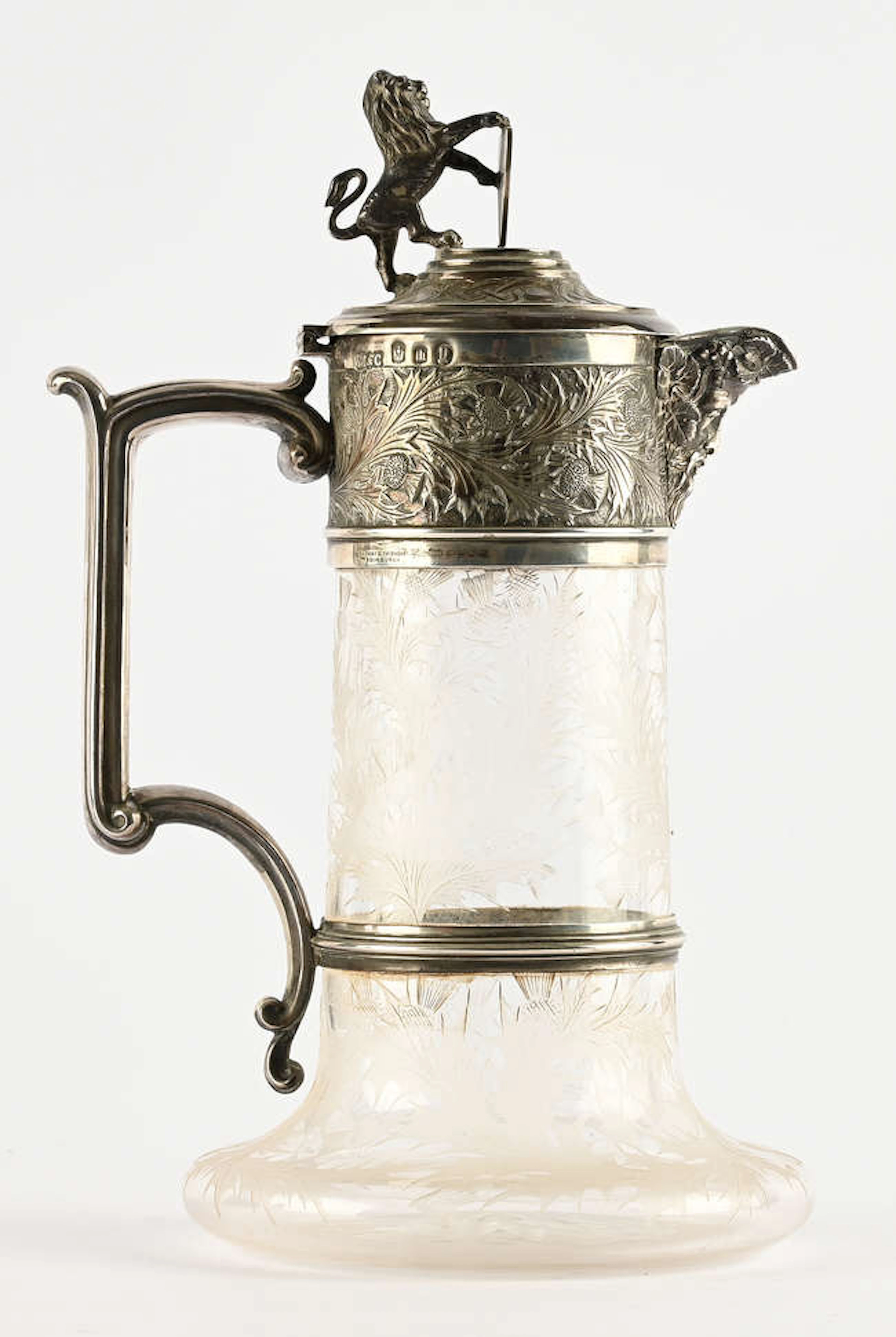 Scottish silver mounted claret jug, the cover with lion finial, over