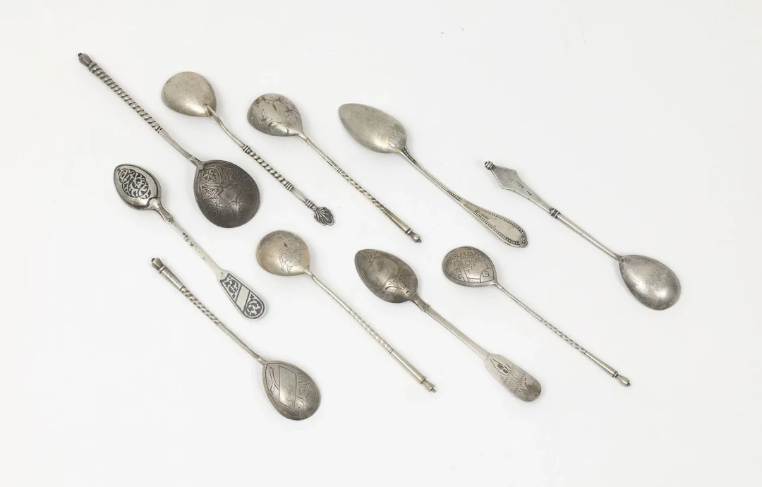 SIX TEA SPOONS by K. FABERGE Various designs. We are including three