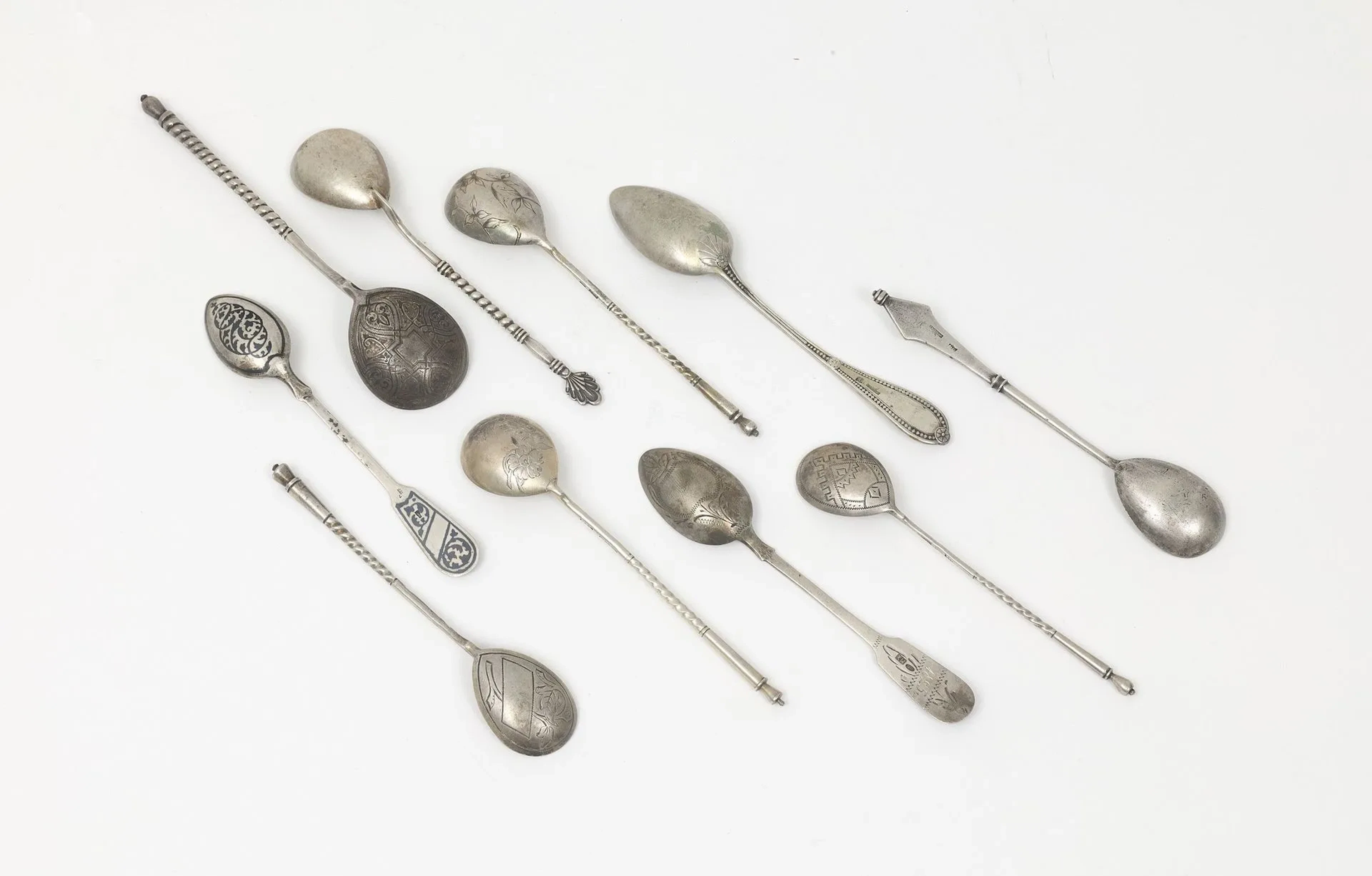 SIX TEA SPOONS by K. FABERGE Various designs. We are including three