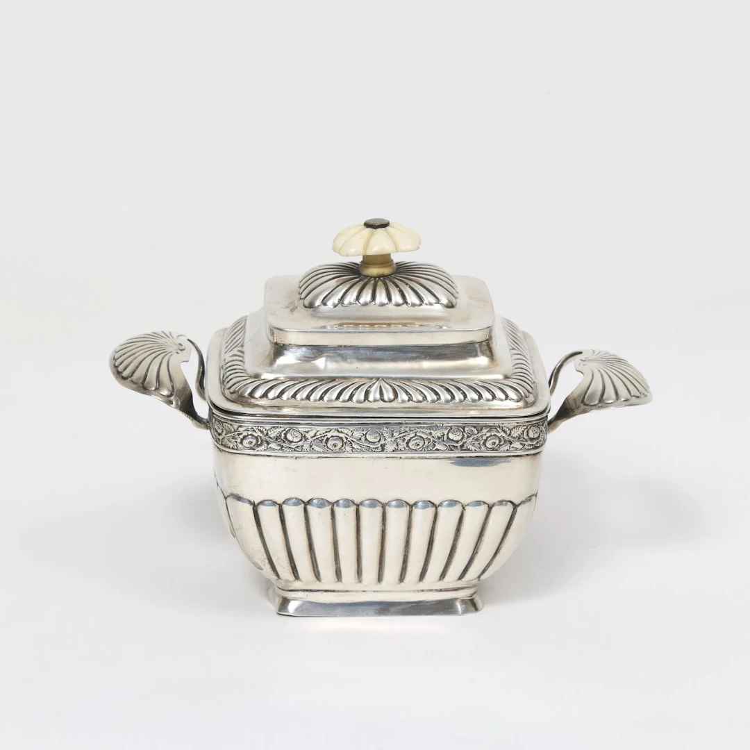 SUGAR BOWL with lid Decorated with floral garlands Engraved and chased