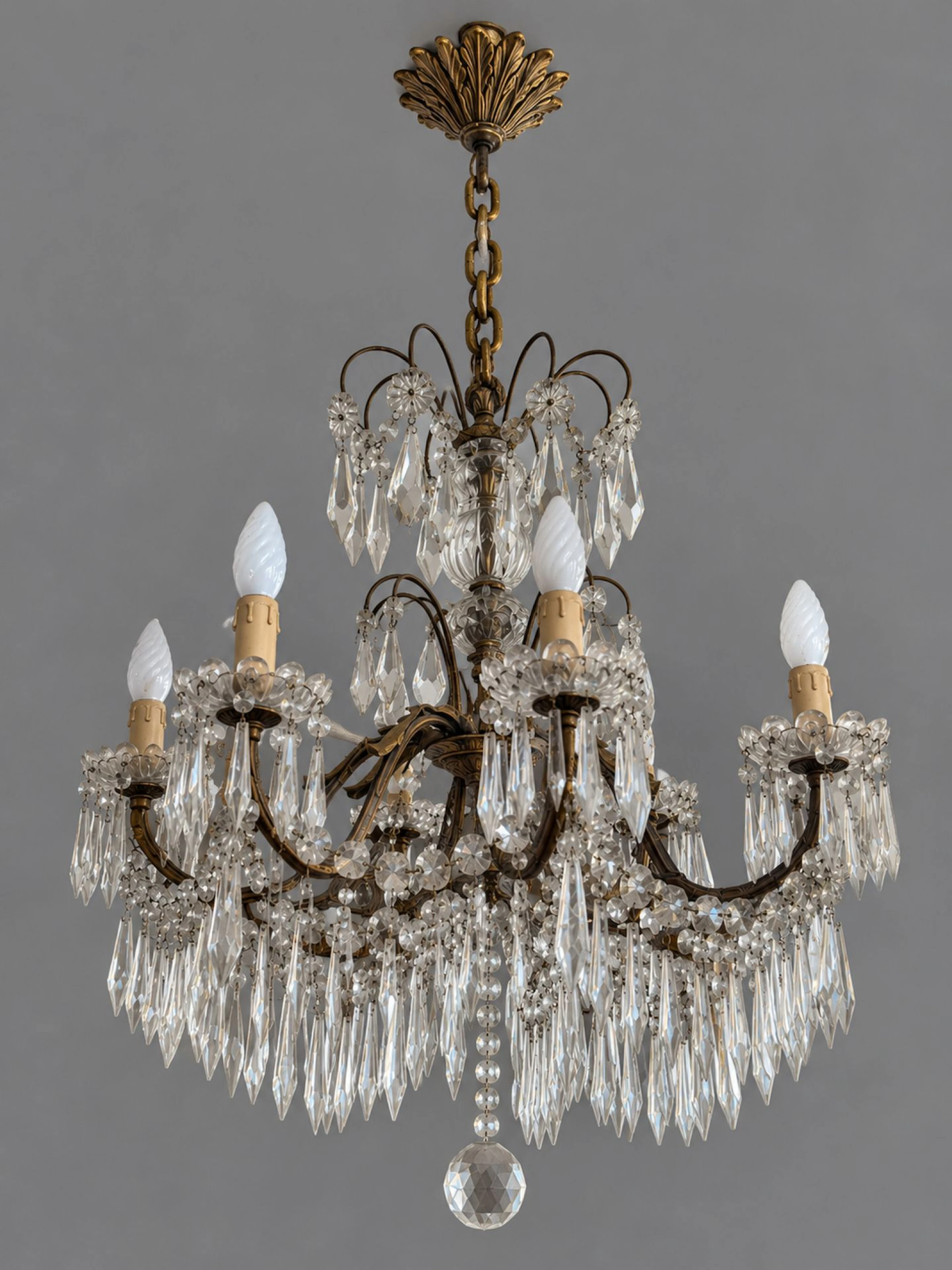 Brass and cut crystal chandelier with eight light arms, rich - Lot 236