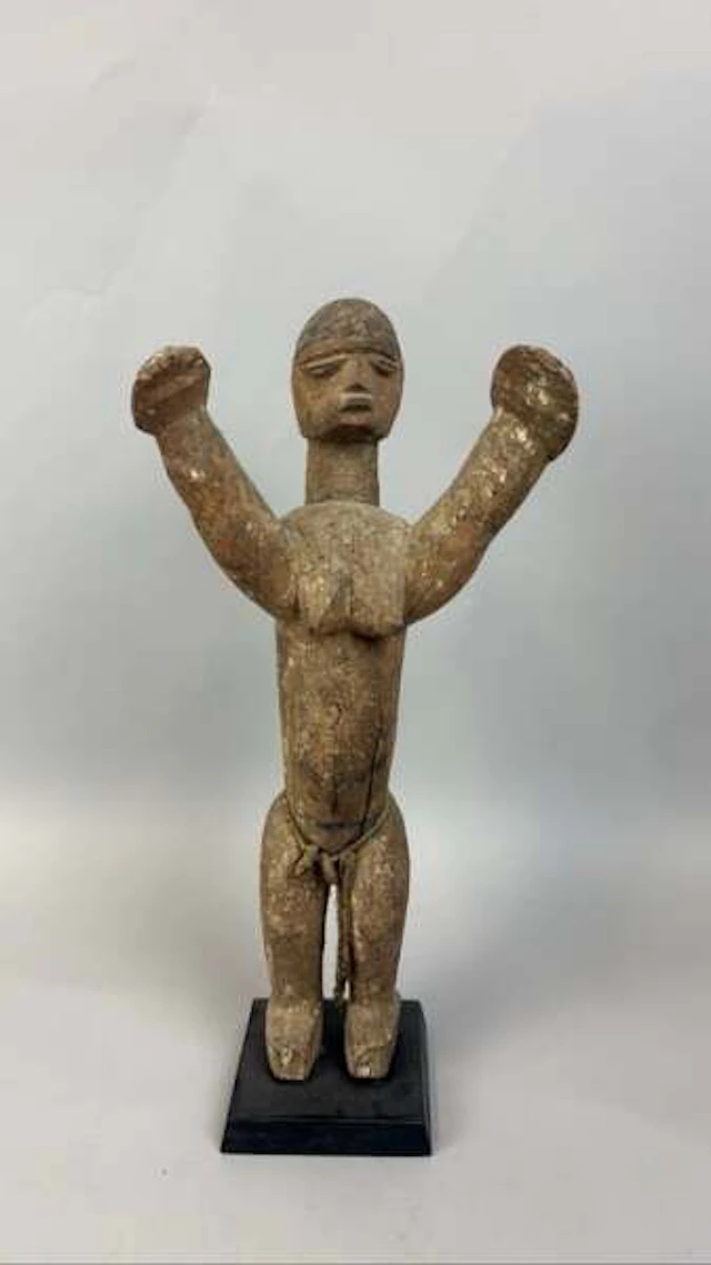 A pair of Lobi-style carved wooden figures with a weathered - Lot 227