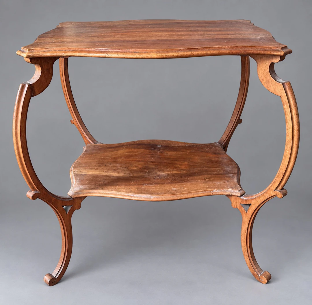 A freestanding table made of molded natural wood with two ir - Lot 257