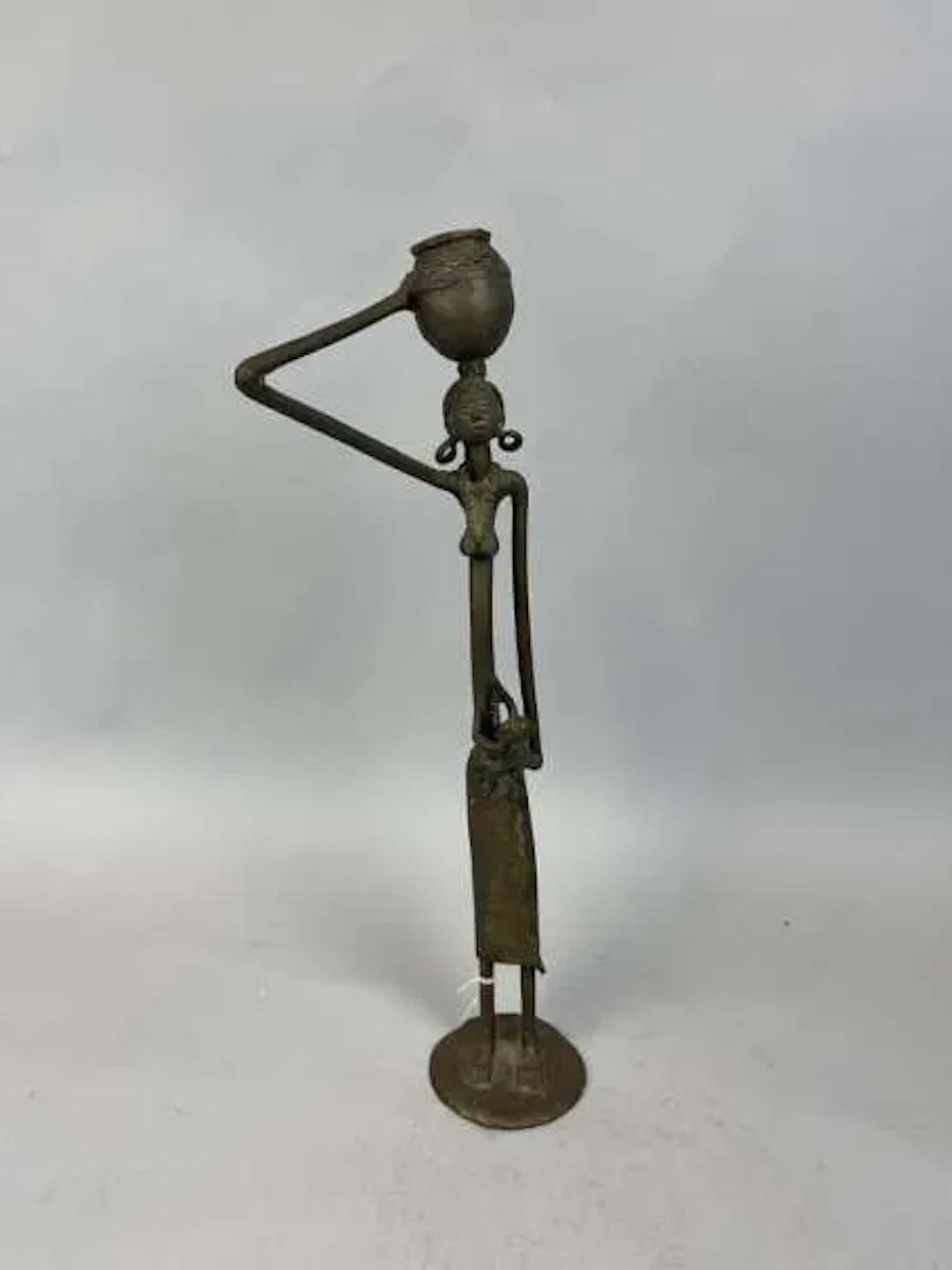 Female statuette cast in a copper alloy, depicting a slender - Lot 216