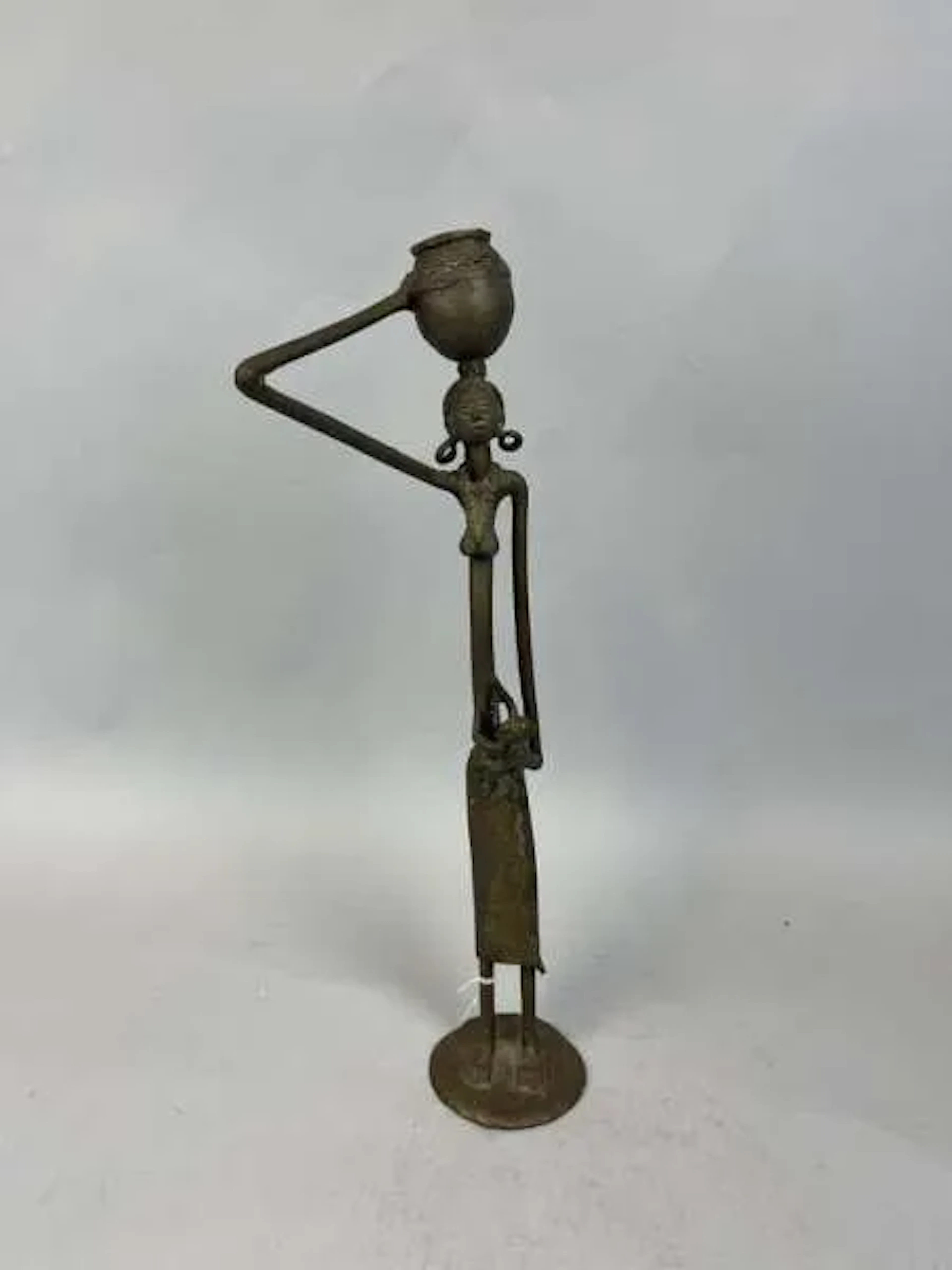Female statuette cast in a copper alloy, depicting a slender - Lot 216