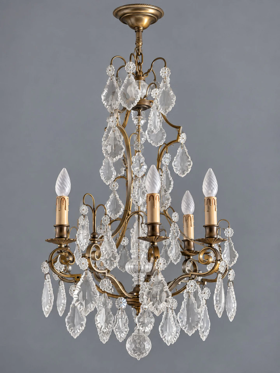 Brass cage chandelier with cut crystal, featuring a structur - Lot 249