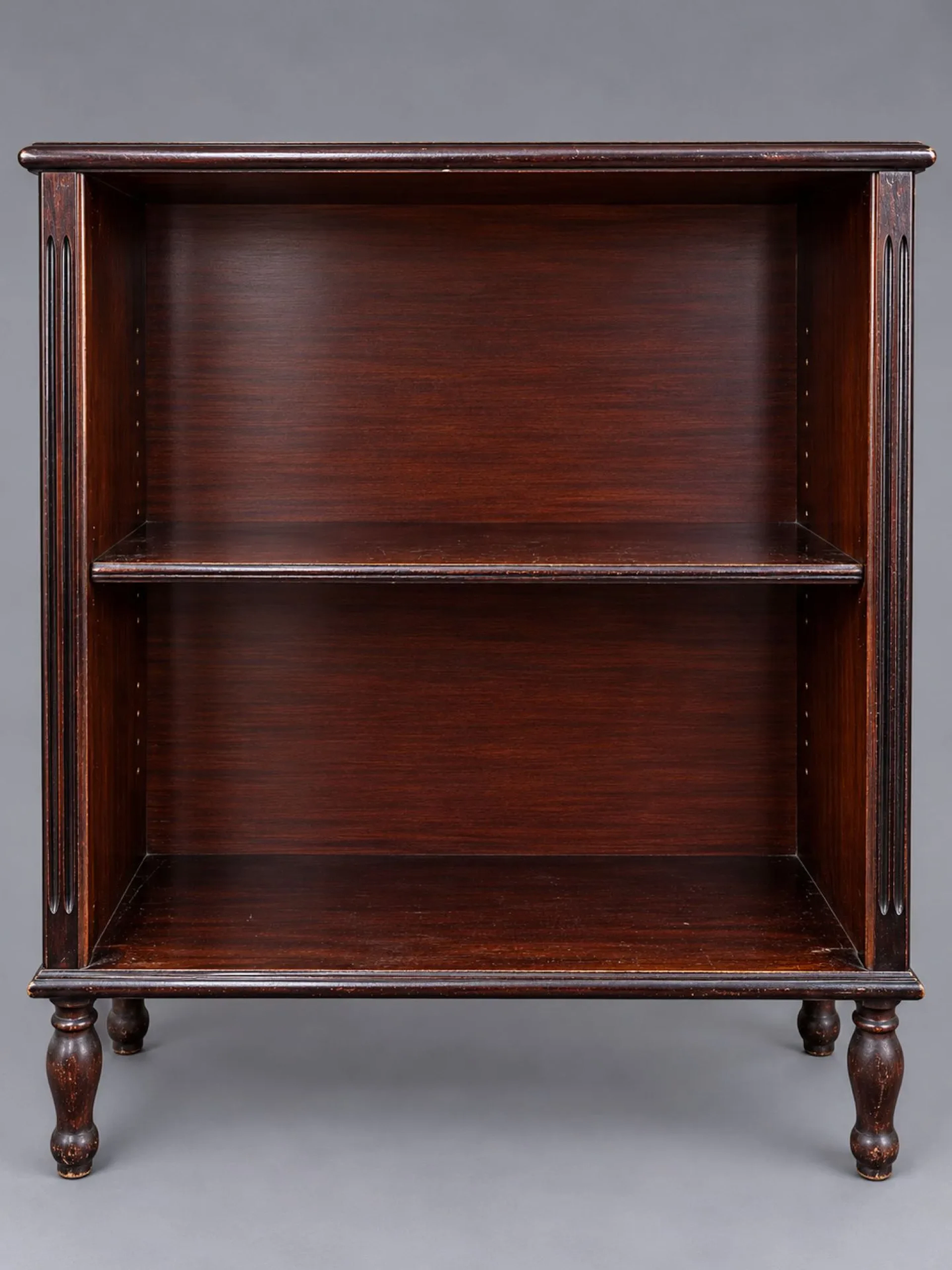 Dark-stained wooden bookcase with two shelves, fluted side p - Lot 275