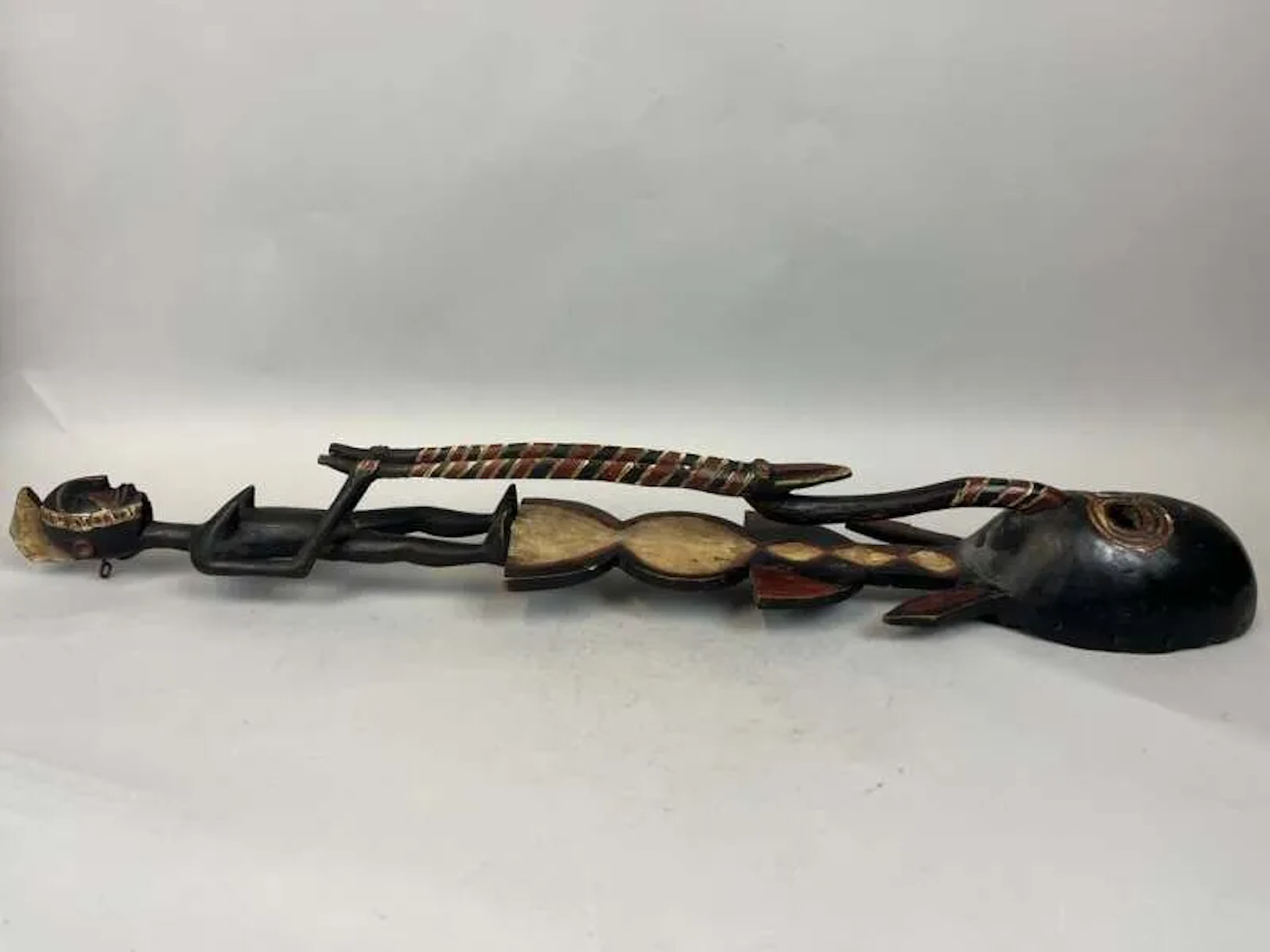 Carved wooden mask with polychrome decoration; the handle is - Lot 238