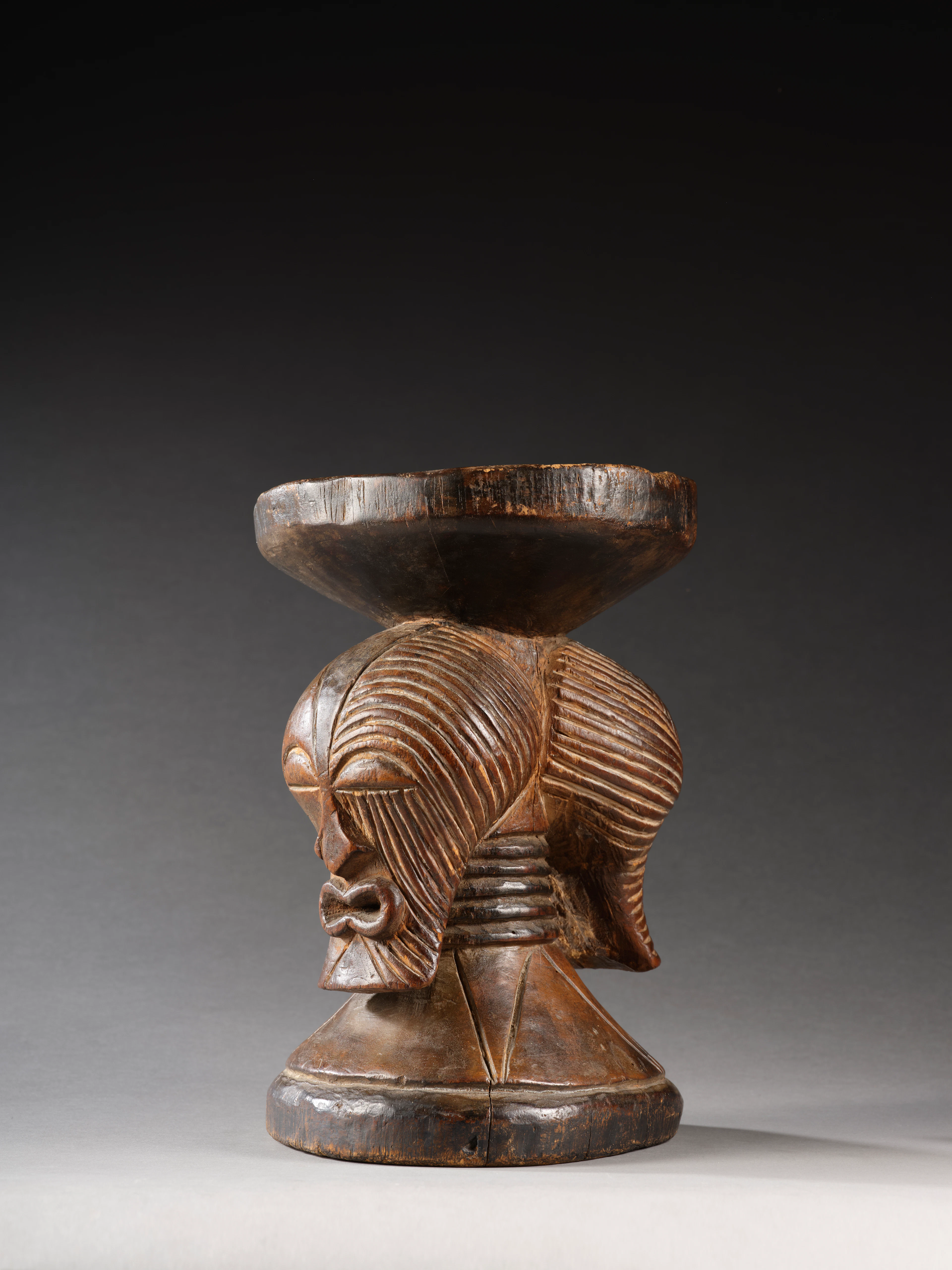 A SONGYE JANIFORM STOOL