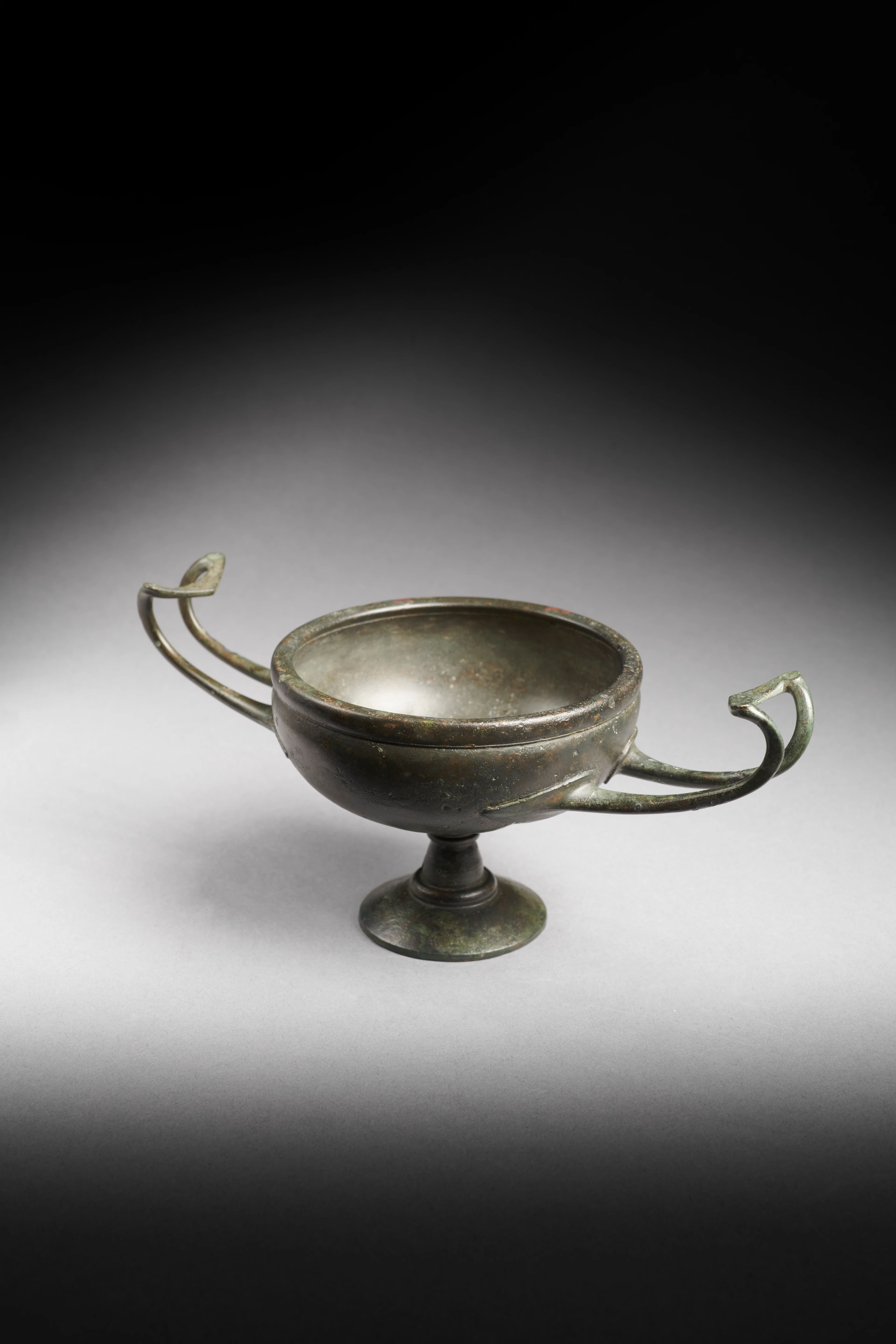 A Greek bronze kylix