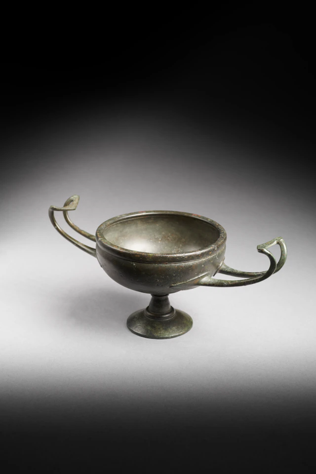 A Greek bronze kylix