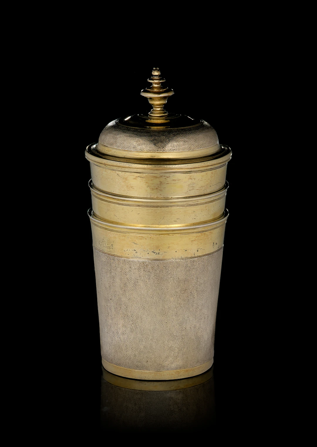 A German set of three parcel-gilt silver nesting snakeskin beakers