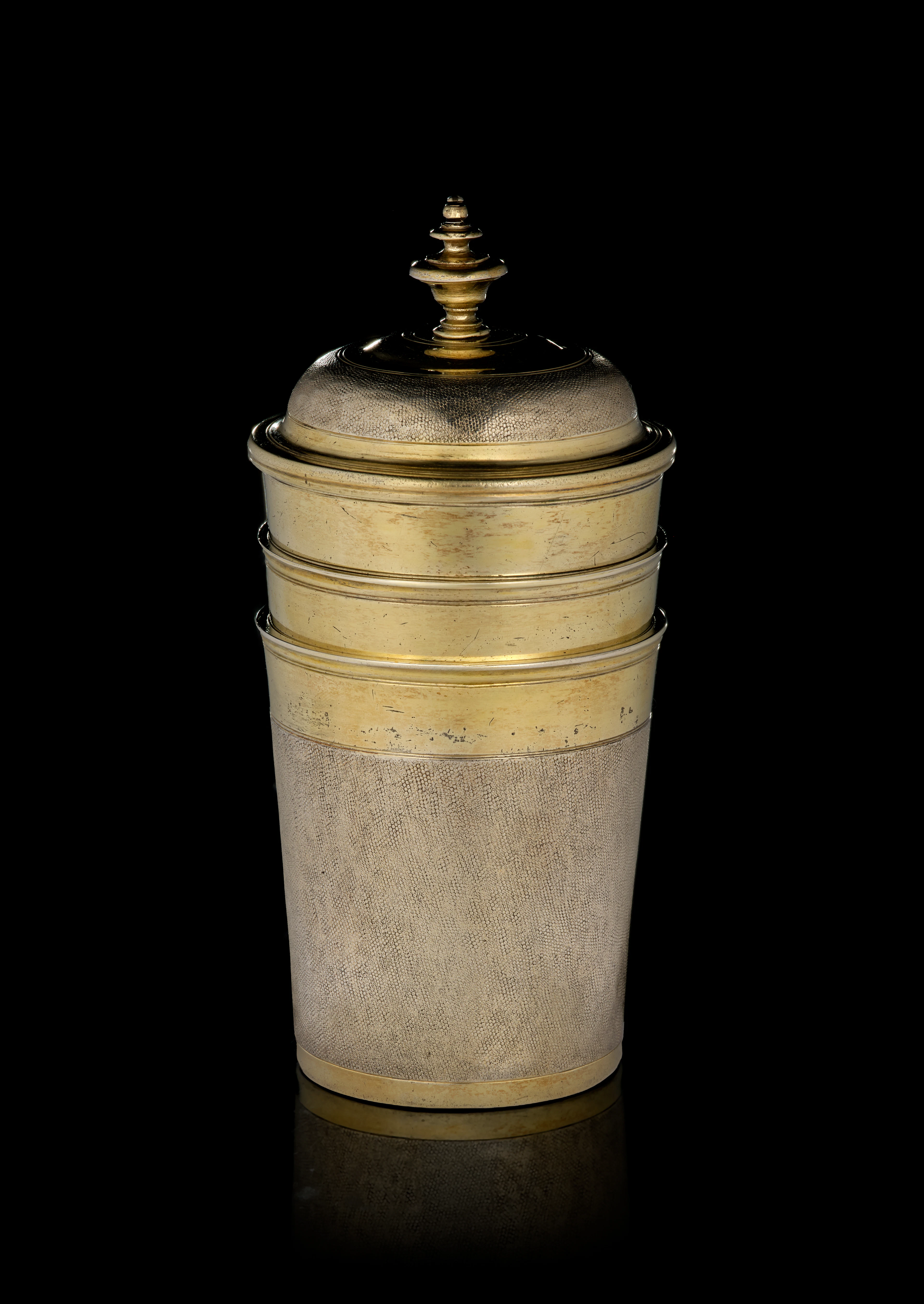 A German set of three parcel-gilt silver nesting snakeskin beakers