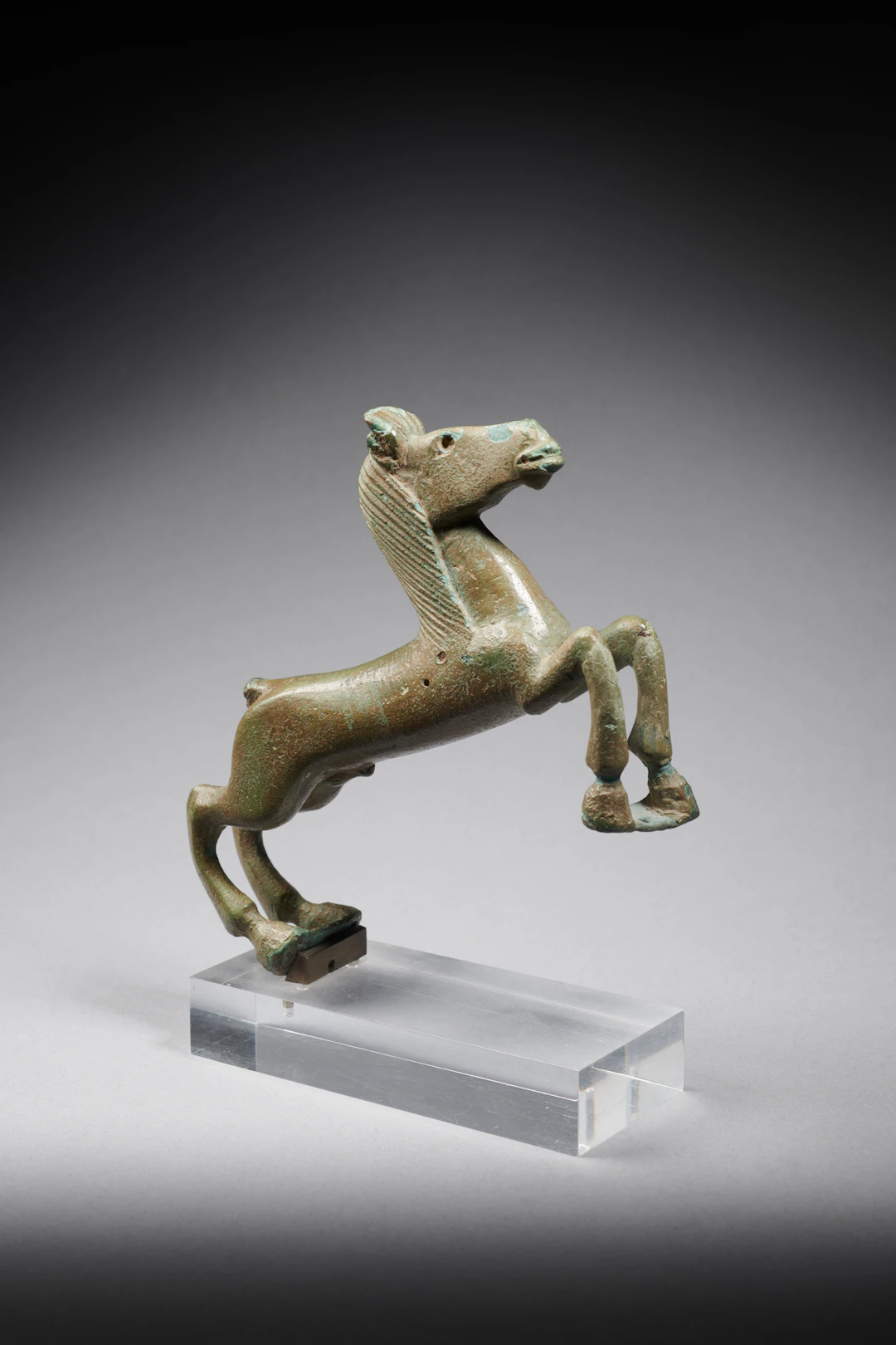 A bronze statuette of a horse (cista handle ?)