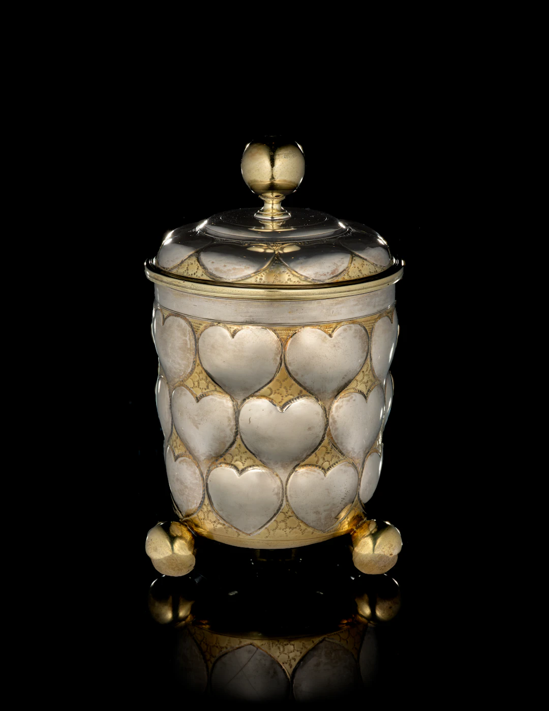 A large German parcel-gilt silver covered beaker with heart motifs