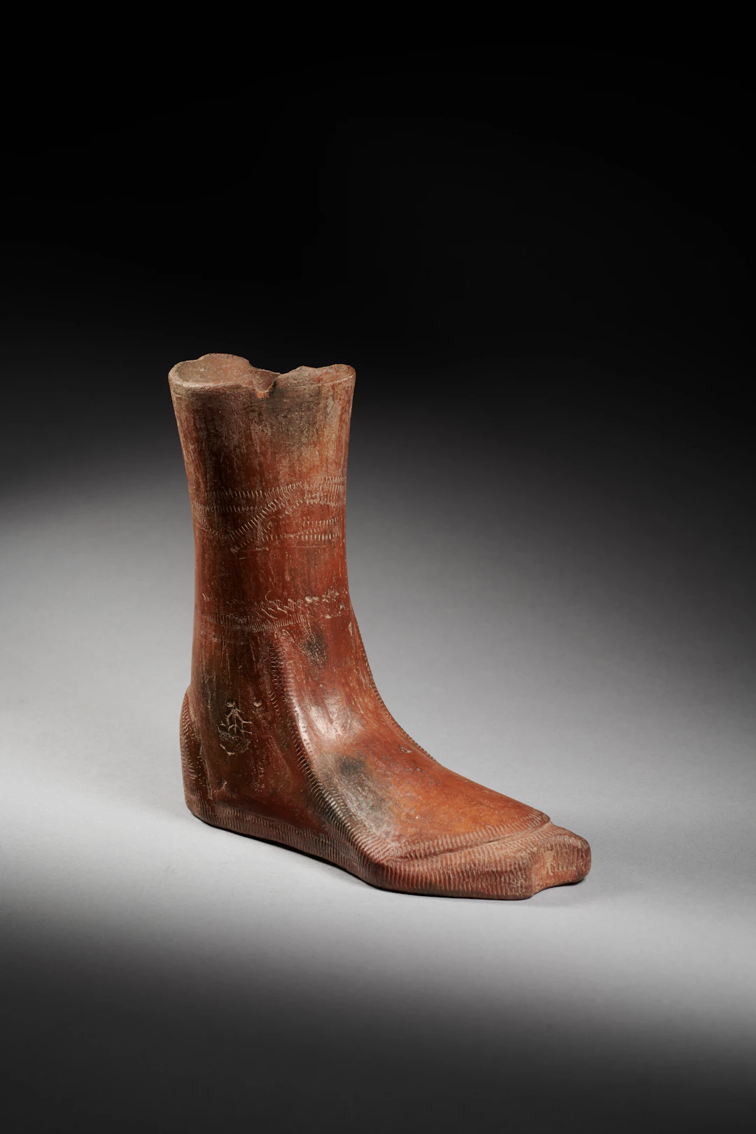A pottery ryhton or votive boot