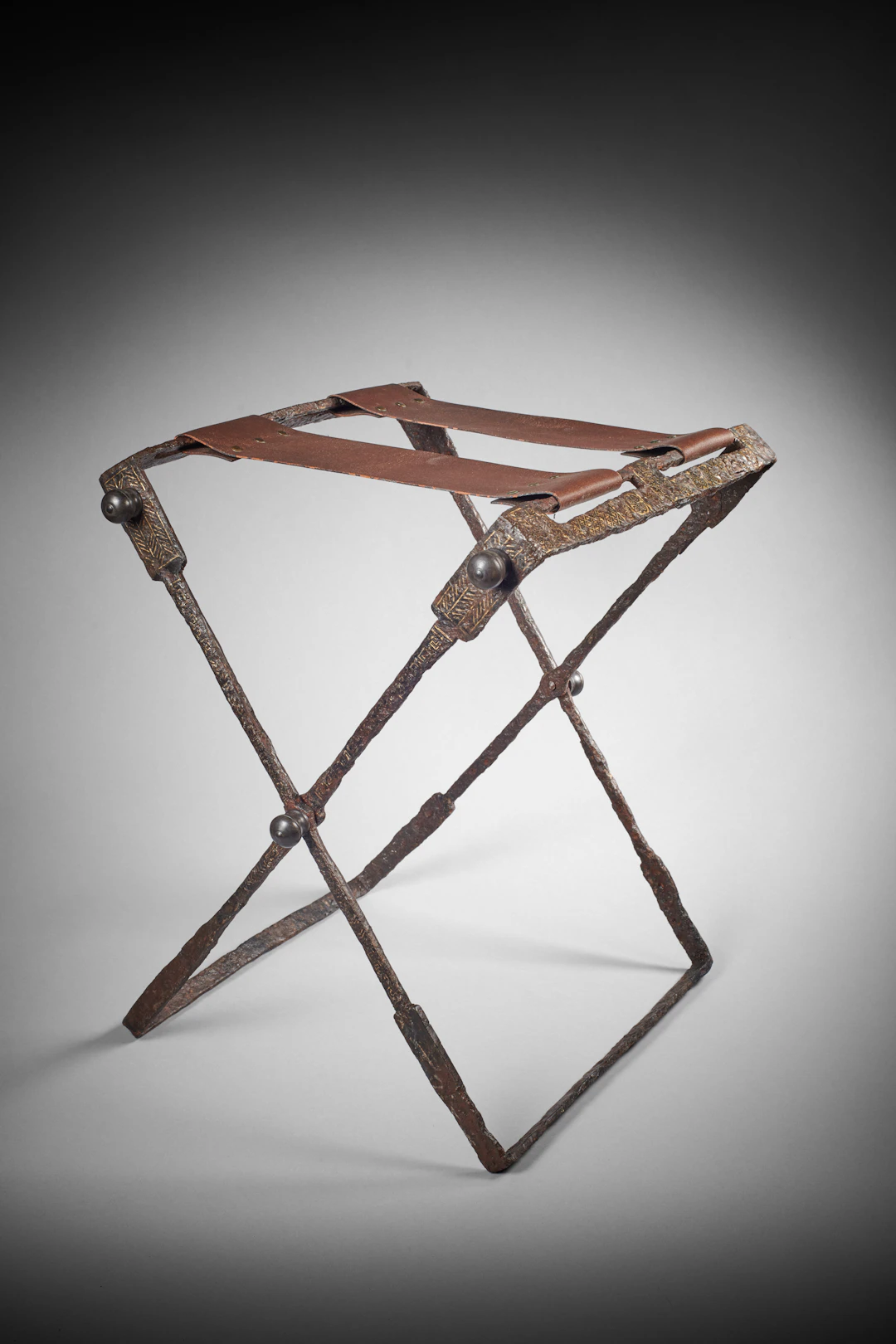 A Roman iron and bronze folding stool