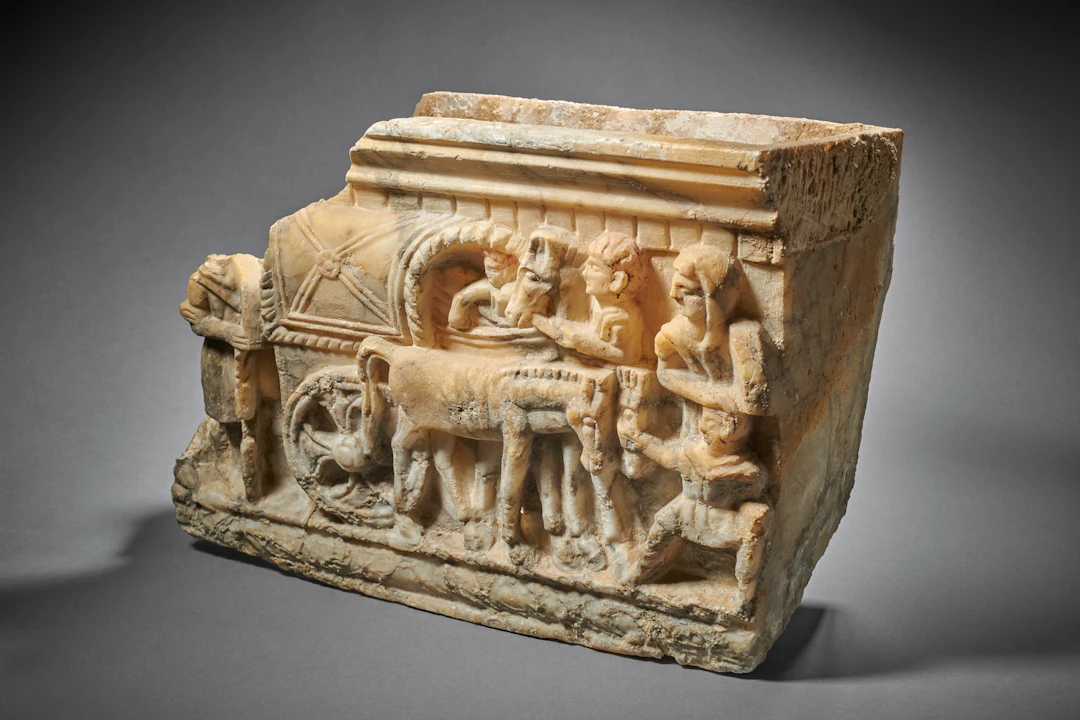 An Etruscan fragmentary alabaster cinerary urn