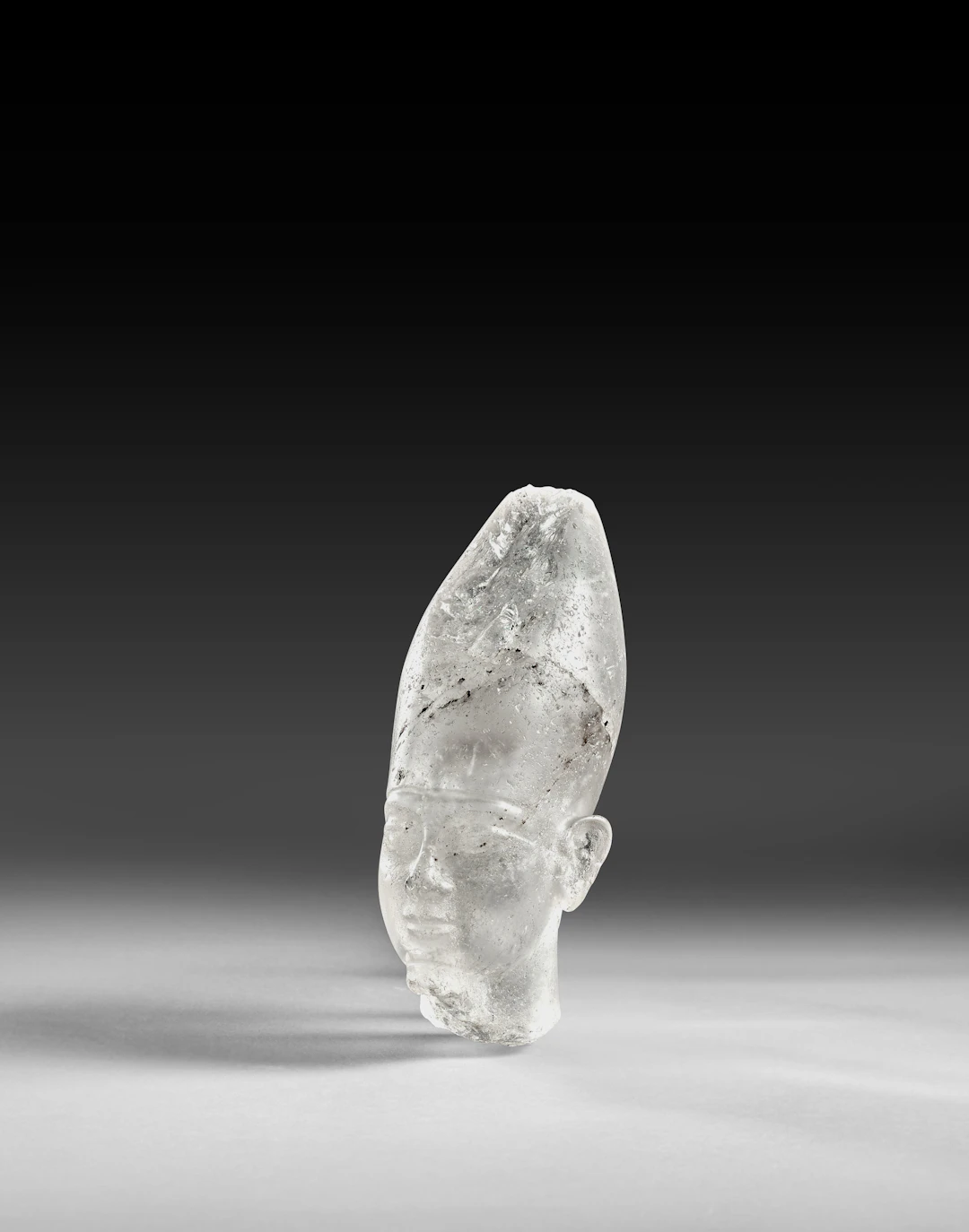 An Egyptian rock crystal royal head