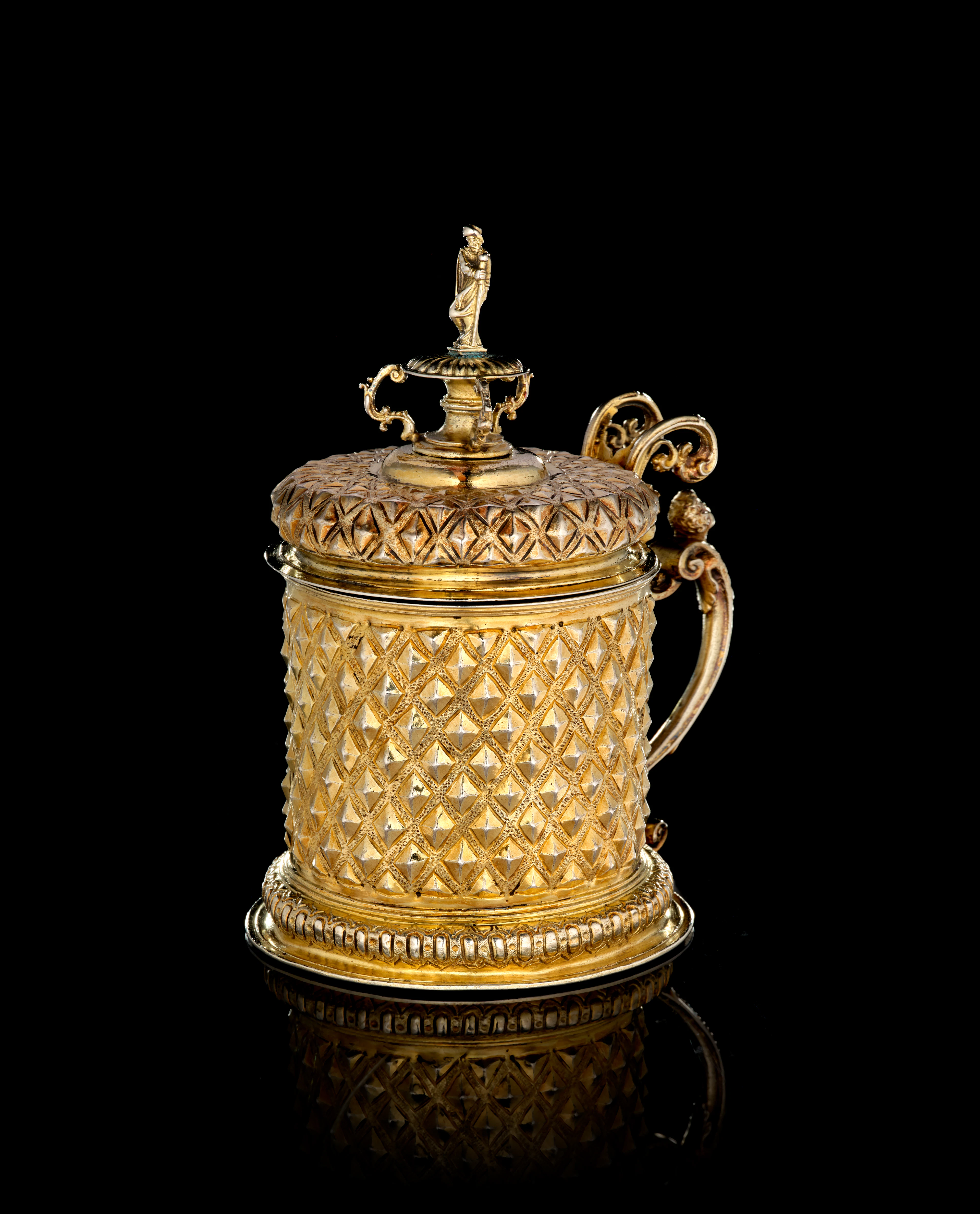 A German silver-gilt covered tankard with diamond motifs, Esaias zur