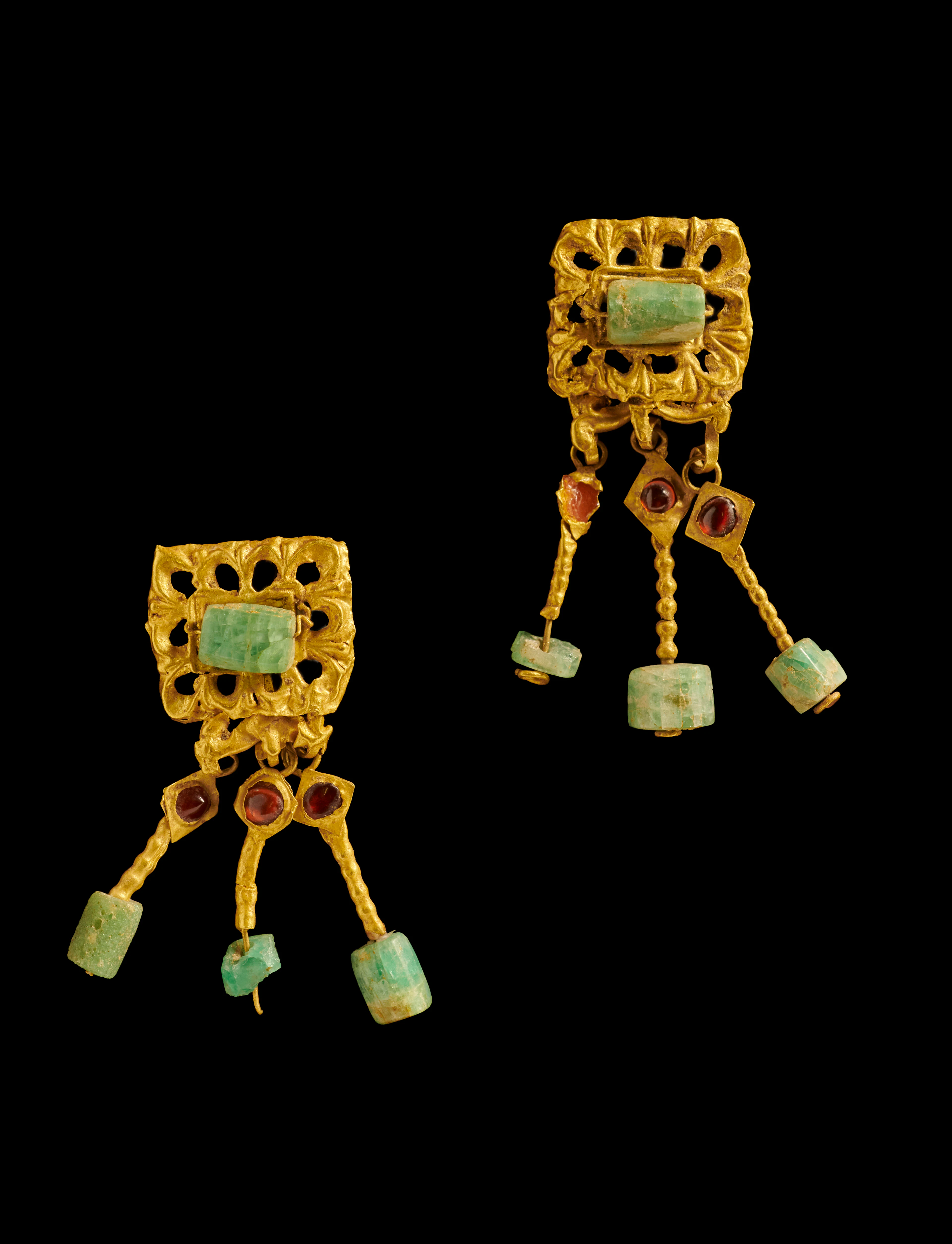 - A Roman pair of gold, emerald and ganret ear pendants