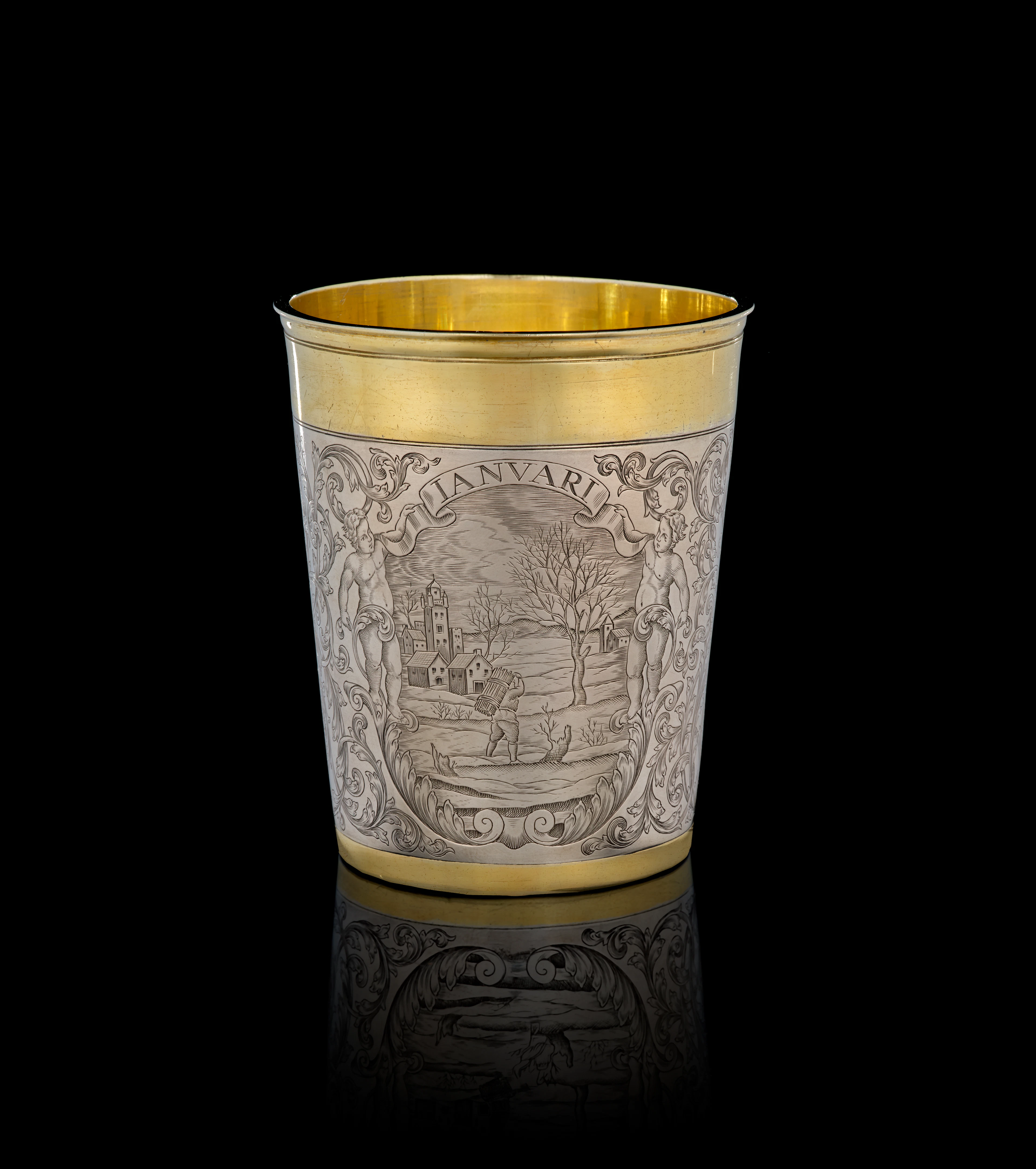 A German parcel-gilt silver "January" beaker, Simon Wickert, Augsburg