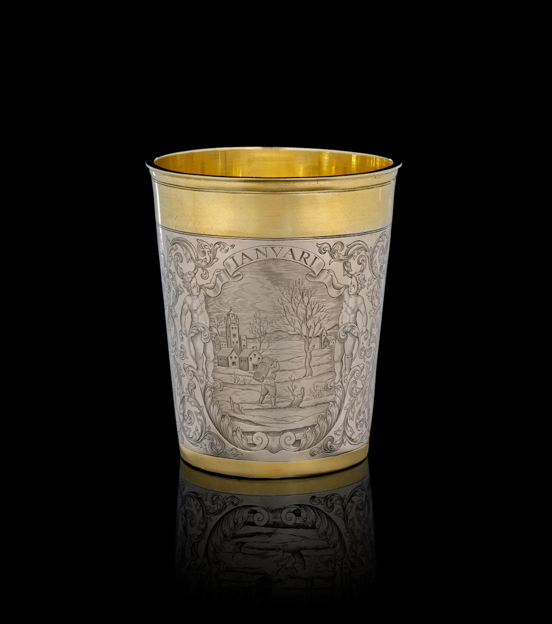 A German parcel-gilt silver "January" beaker, Simon Wickert, Augsburg