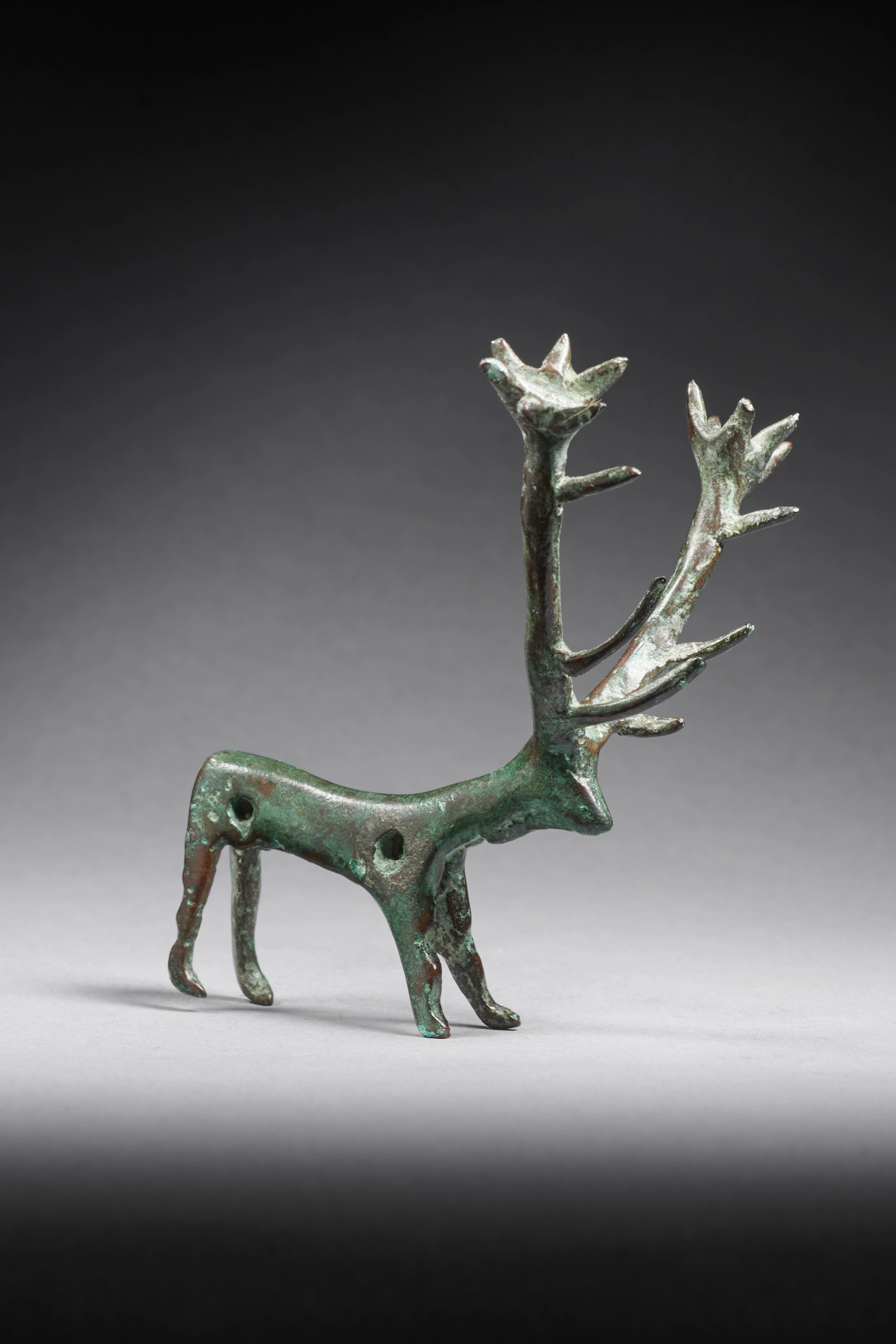 An Amlash bronze stag pendant