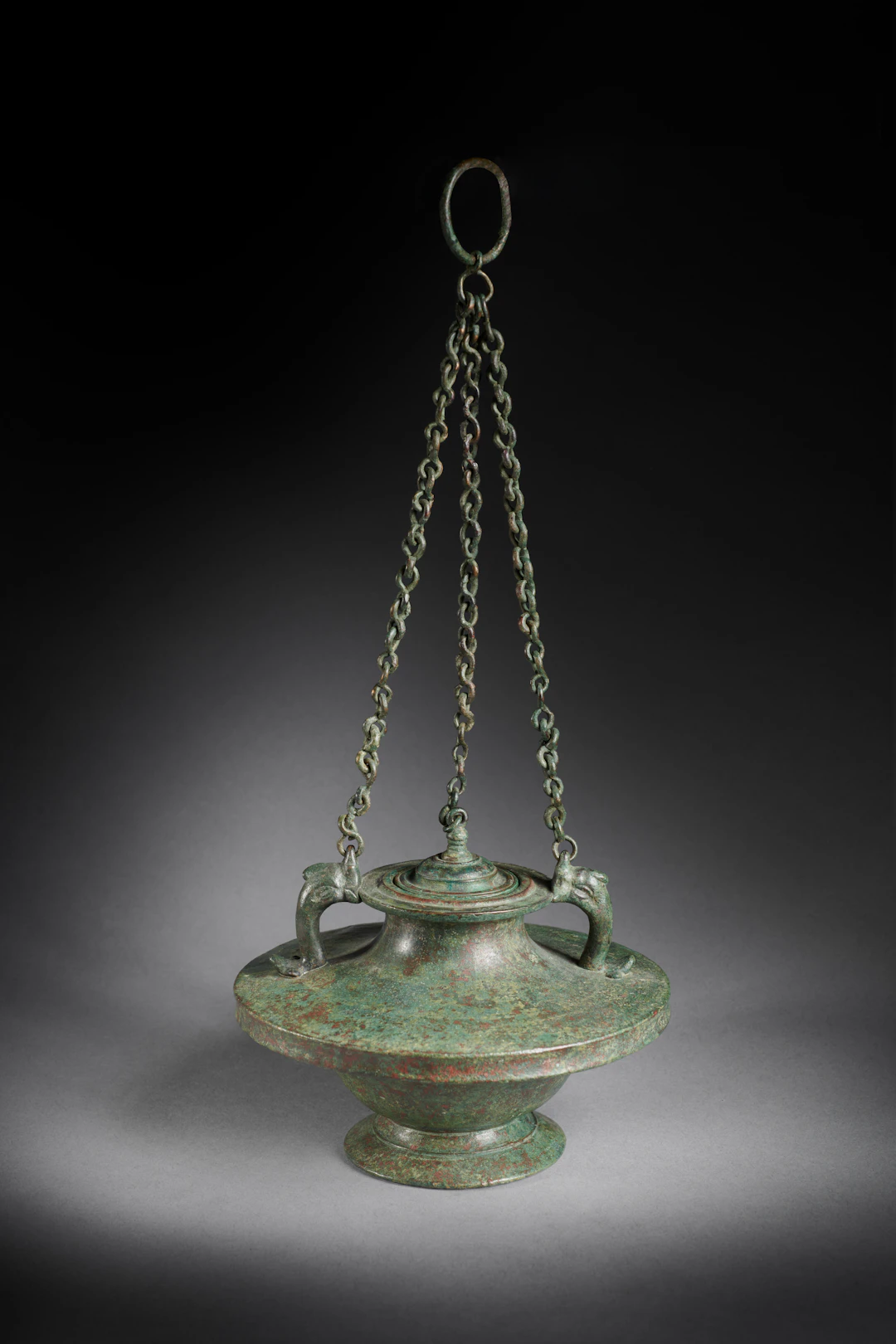 A Roman bronze hanging lidded pyxis