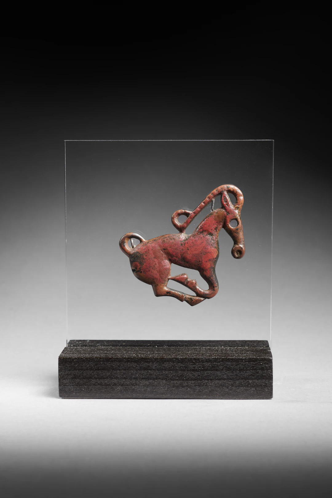 An Ordos bronze plaque with an ibex