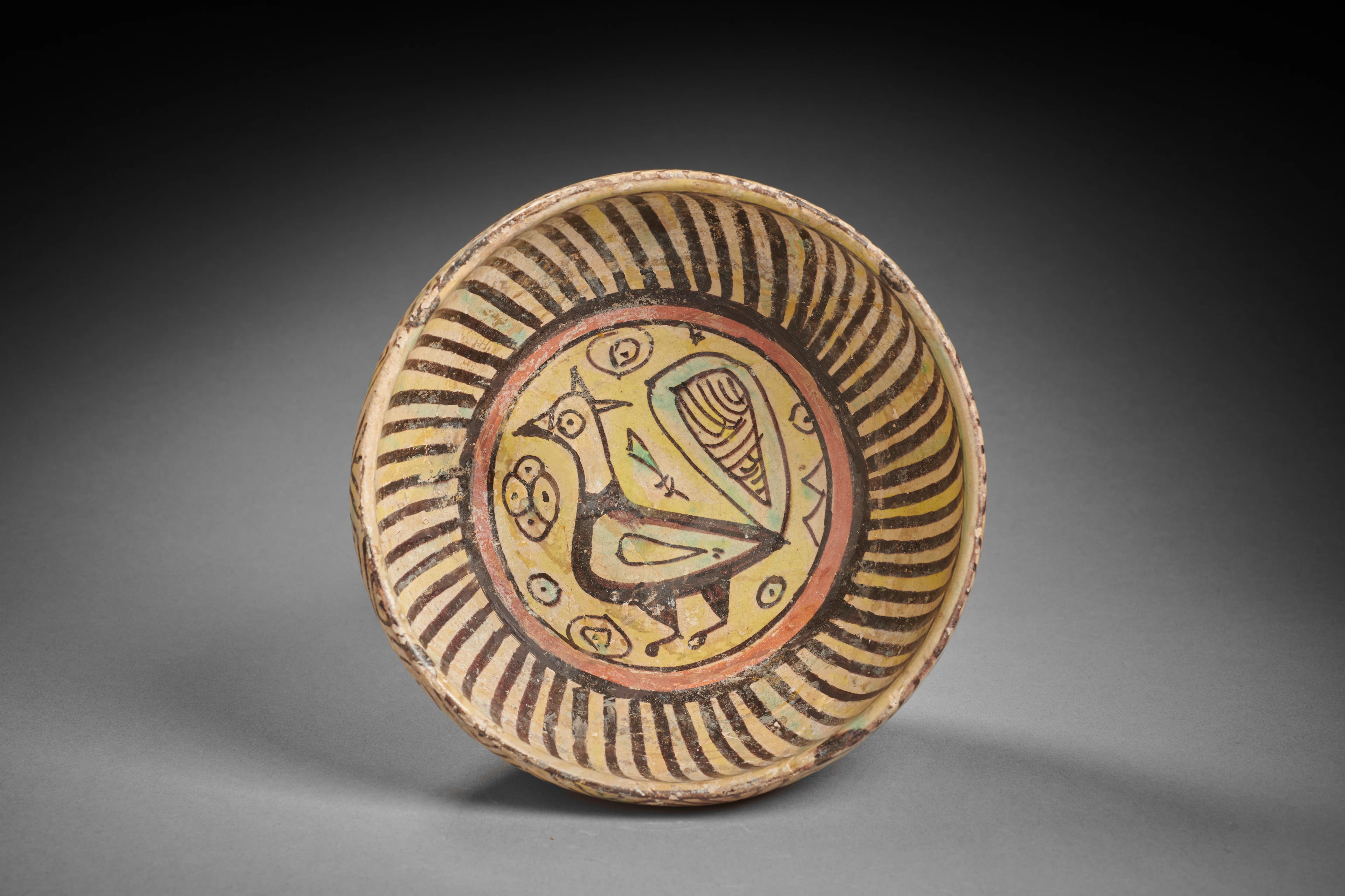 A Nishapur Bowl Decorated with a Peacock