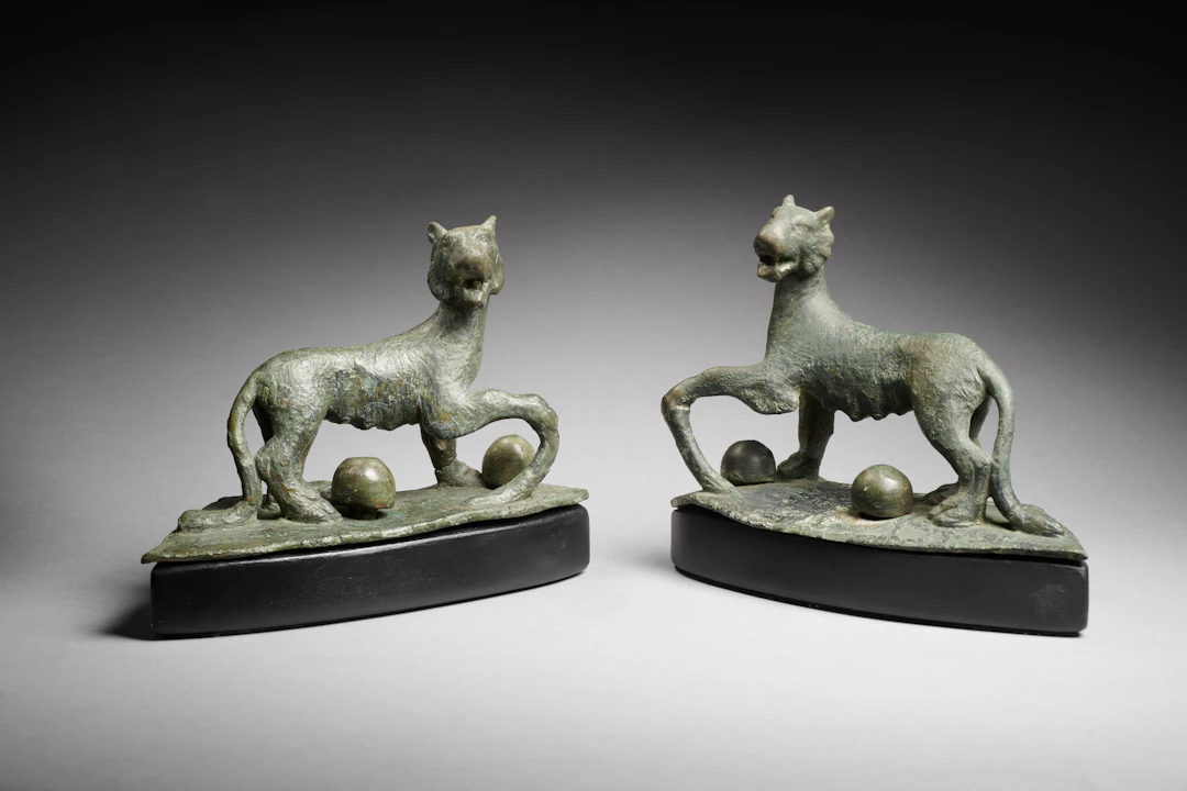 A Roman bronze pair of roaring panthers