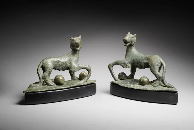 A Roman bronze pair of roaring panthers