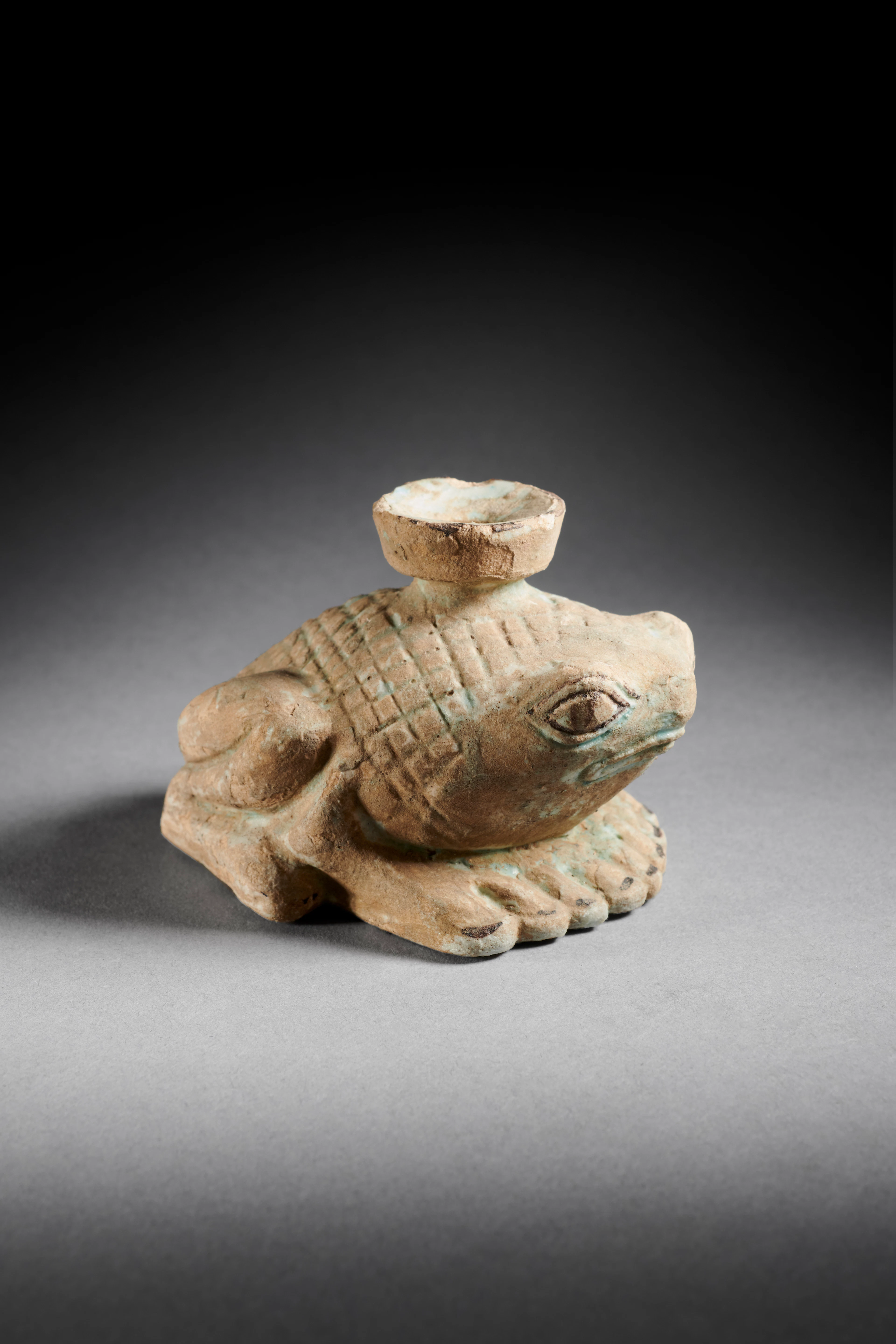 A Greek faience frog-shaped aryballos