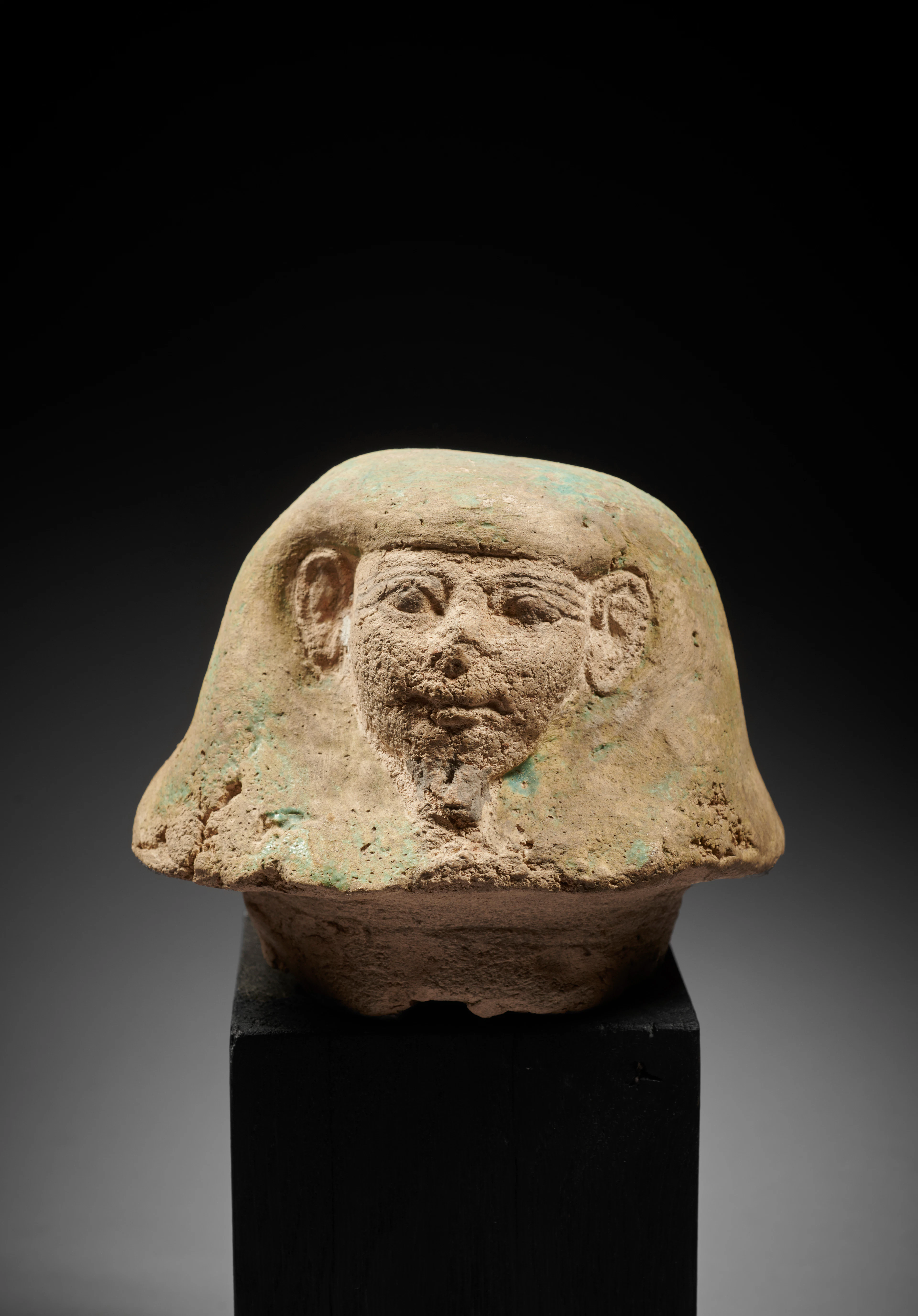- An Egyptian terracotta canopic jar lid