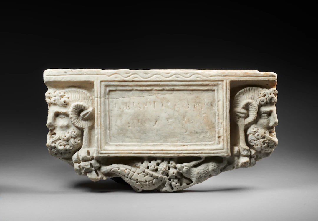 A Roman marble panel from a cinerarium
