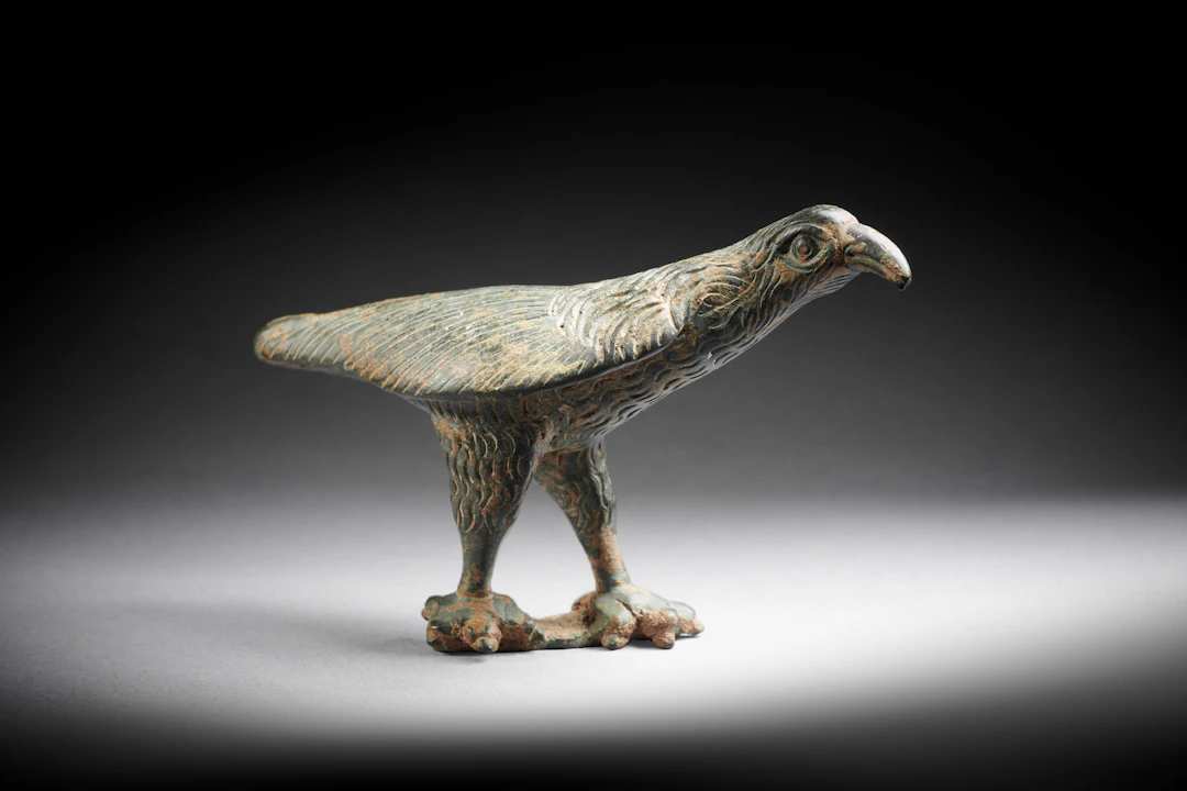 A Roman bronze statuette of a raven