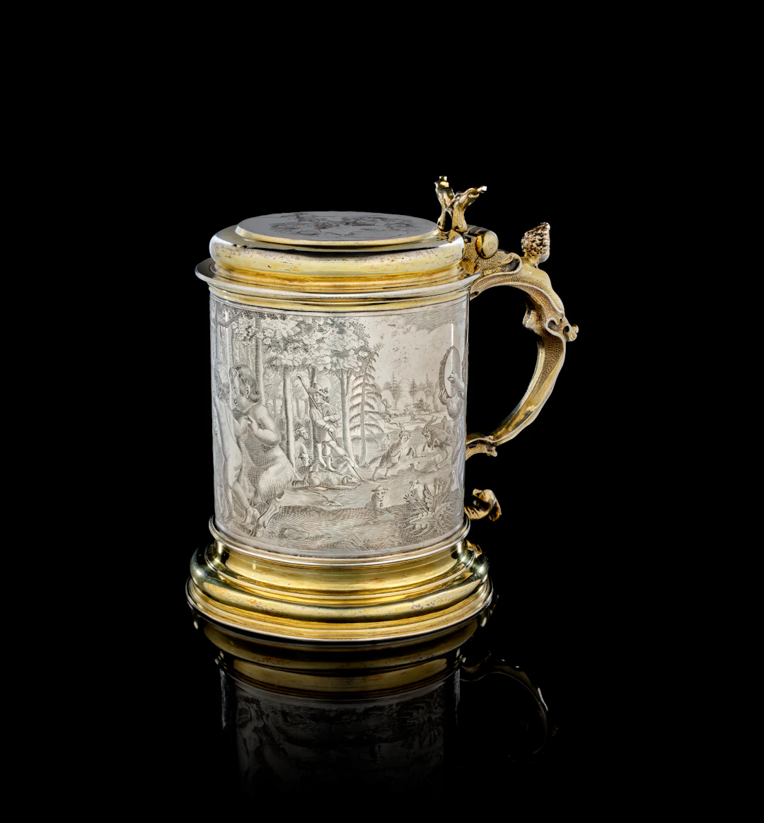 A large German parcel-gilt silver covered tankard, Heinrich Sesemann