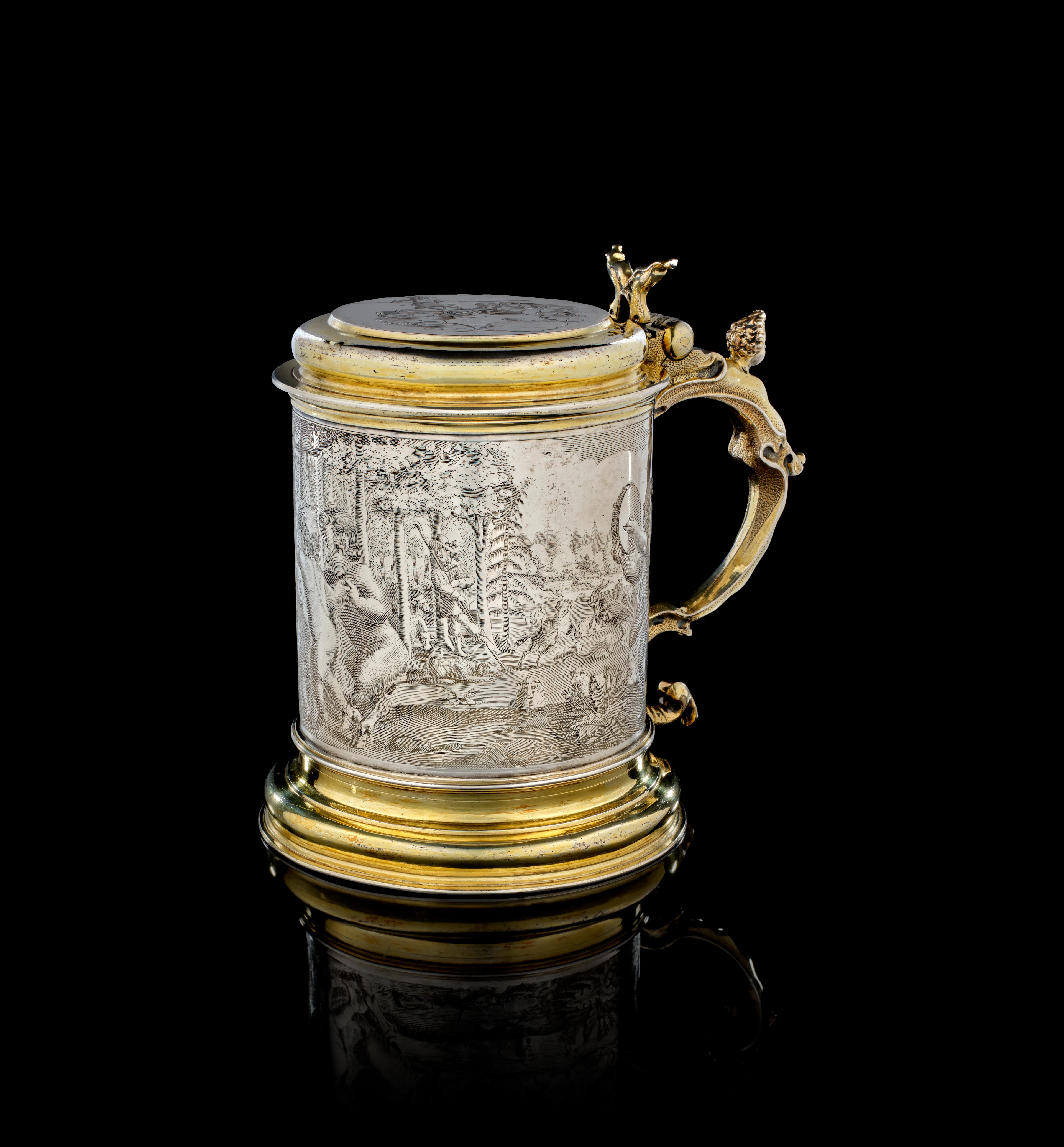 A large German parcel-gilt silver covered tankard, Heinrich Sesemann