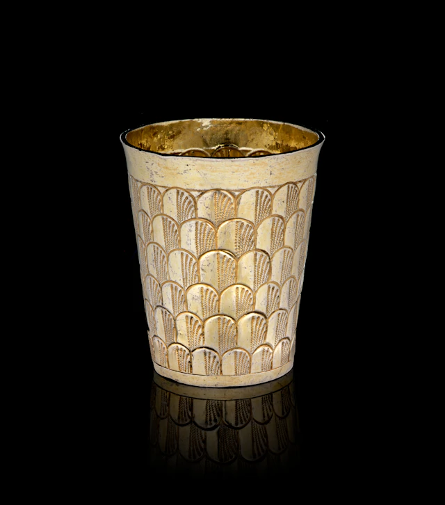 A Swiss silver-gilt beaker with peacock feathers motifs, Hans Heinrich
