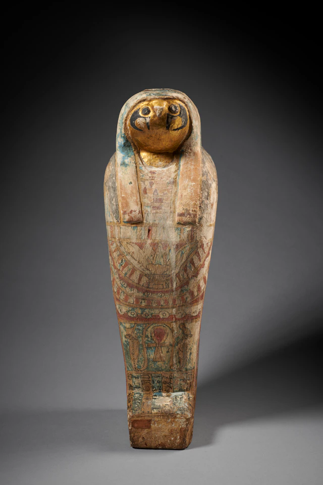 An Egyptian painted wood falcon-headed coffin