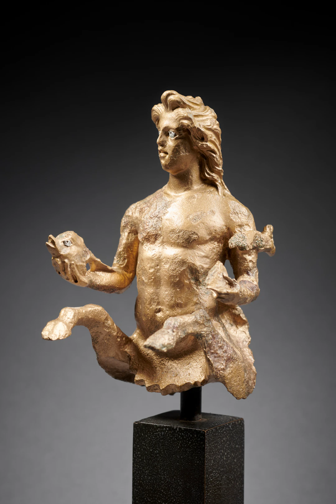 A Greco-Roman bronze triton