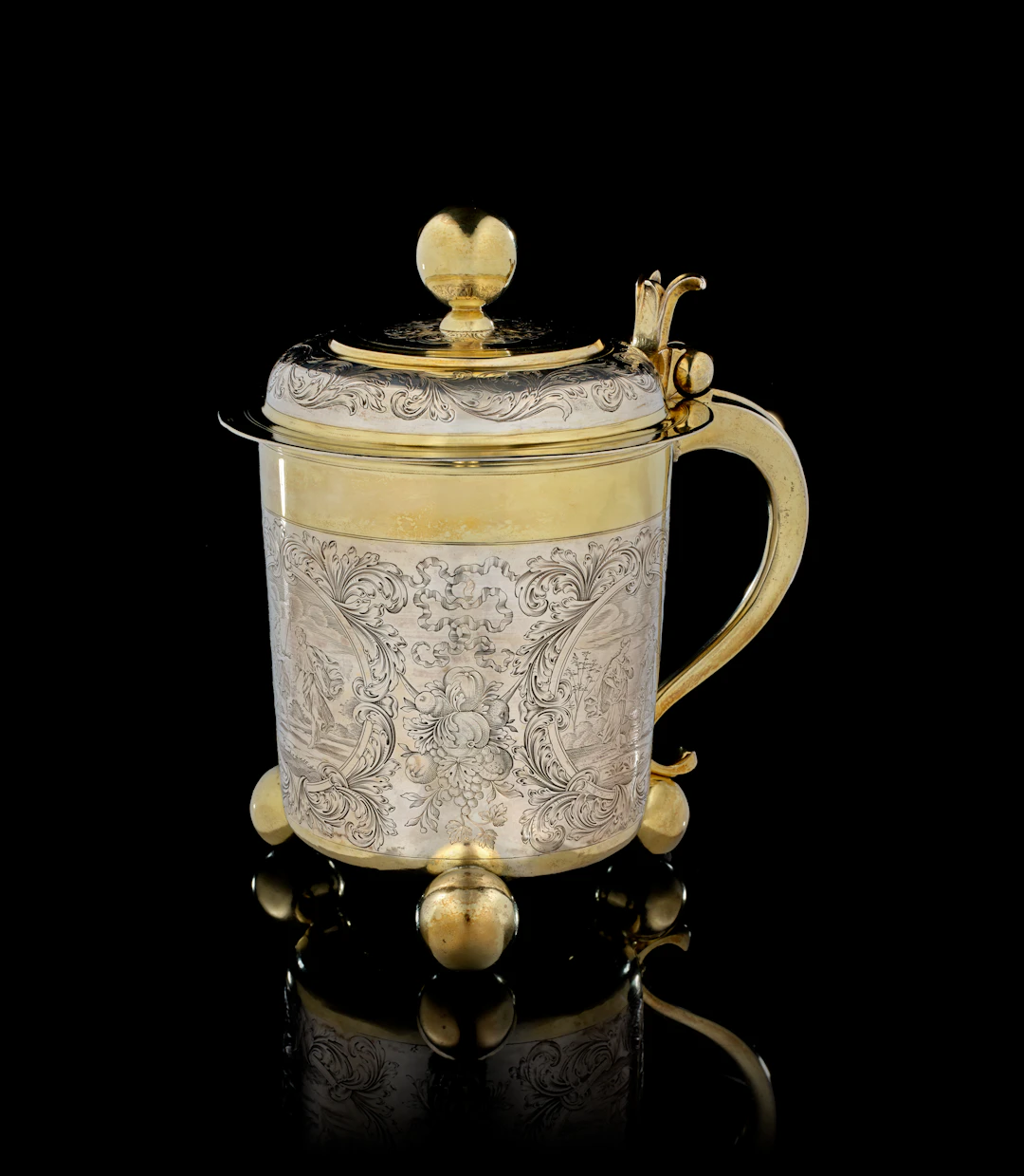 A large German parcel-gilt silver covered tankard, Cornelius Poppe