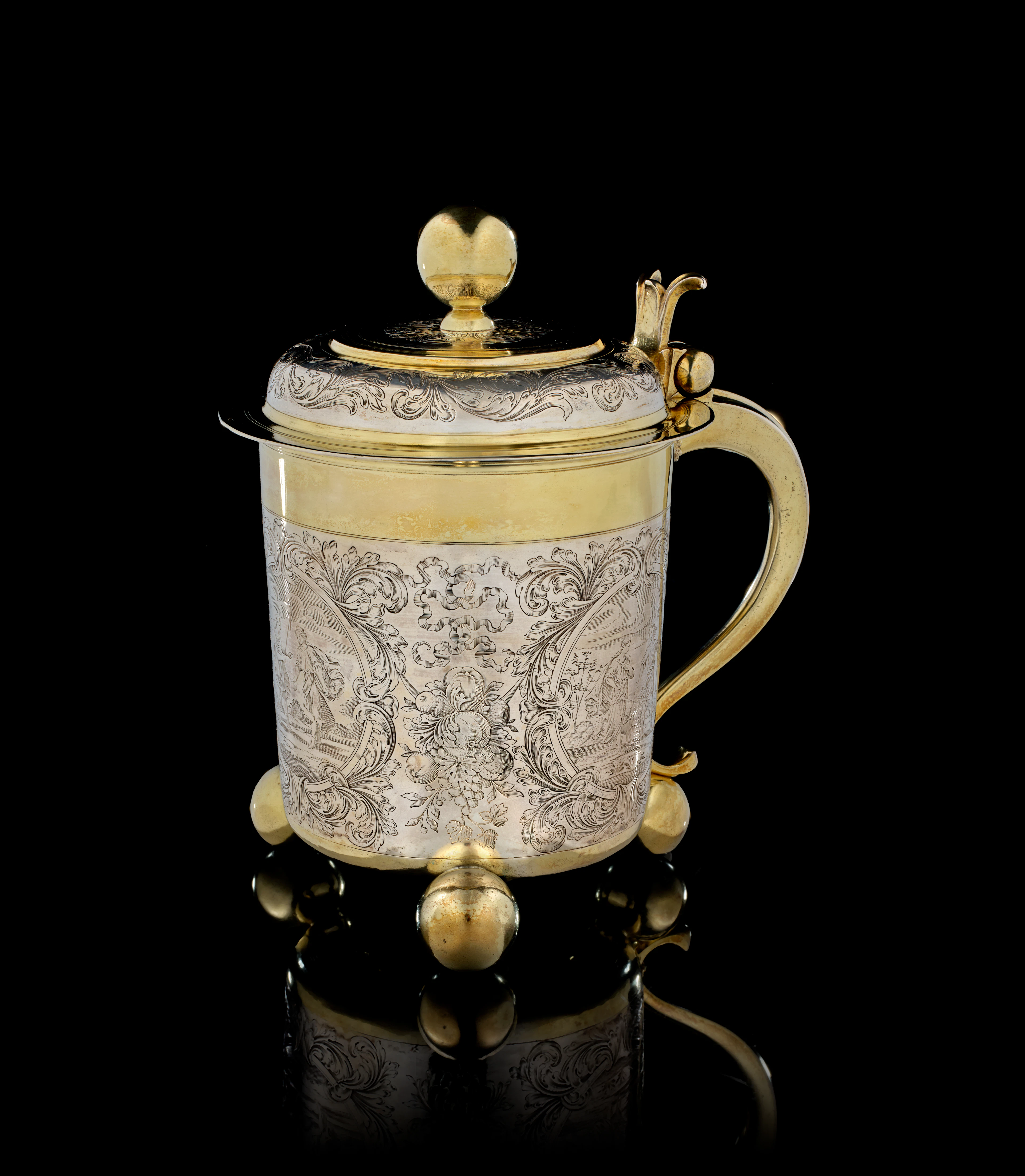 A large German parcel-gilt silver covered tankard, Cornelius Poppe