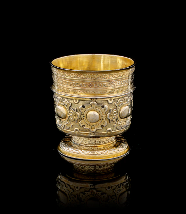 A German silver-gilt coin beaker, Arnold Schmidt, Nuremberg, 1571