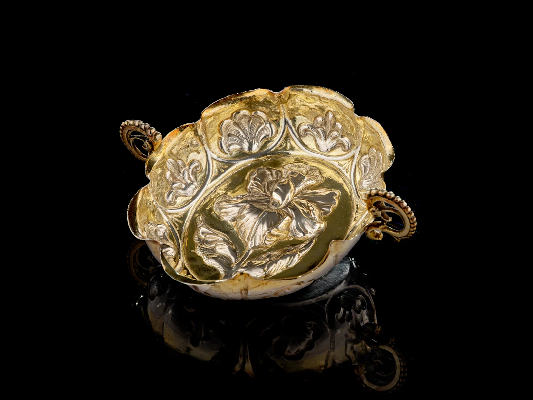 A German parcel-gilt silver wine-taster, Paul Solanier, Augsburg, 1705-1709