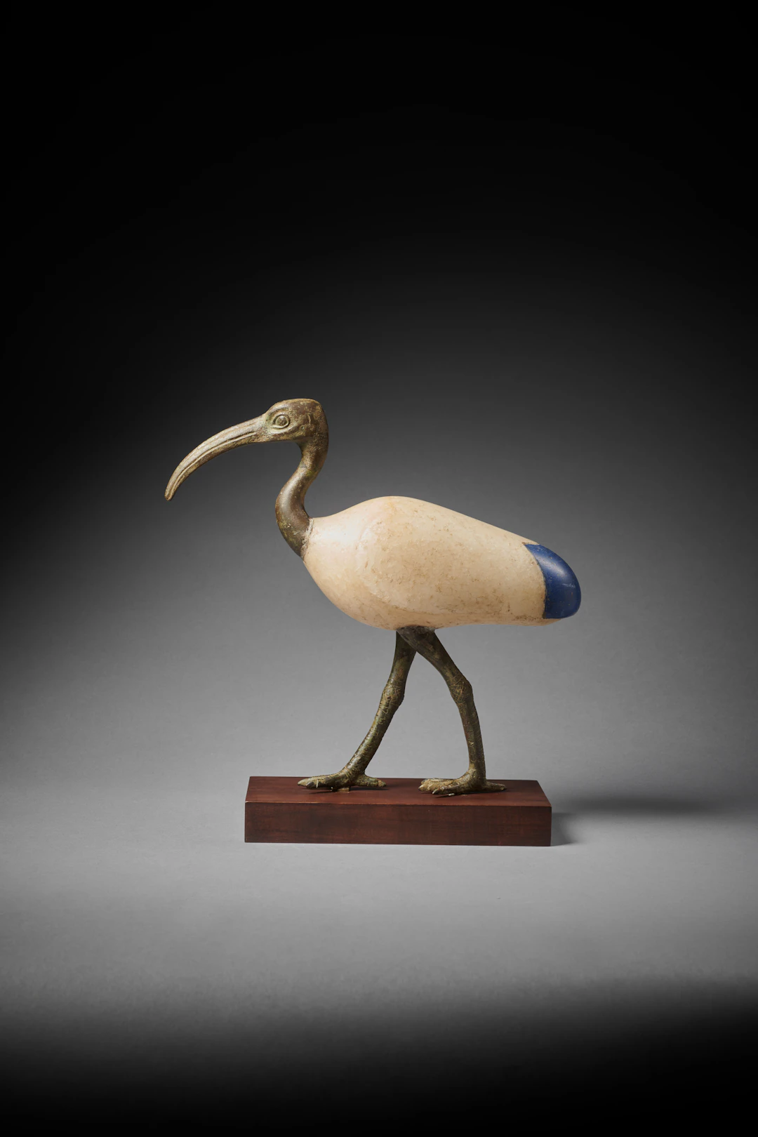 An Egyptian bronze, alabaster and glass Ibis