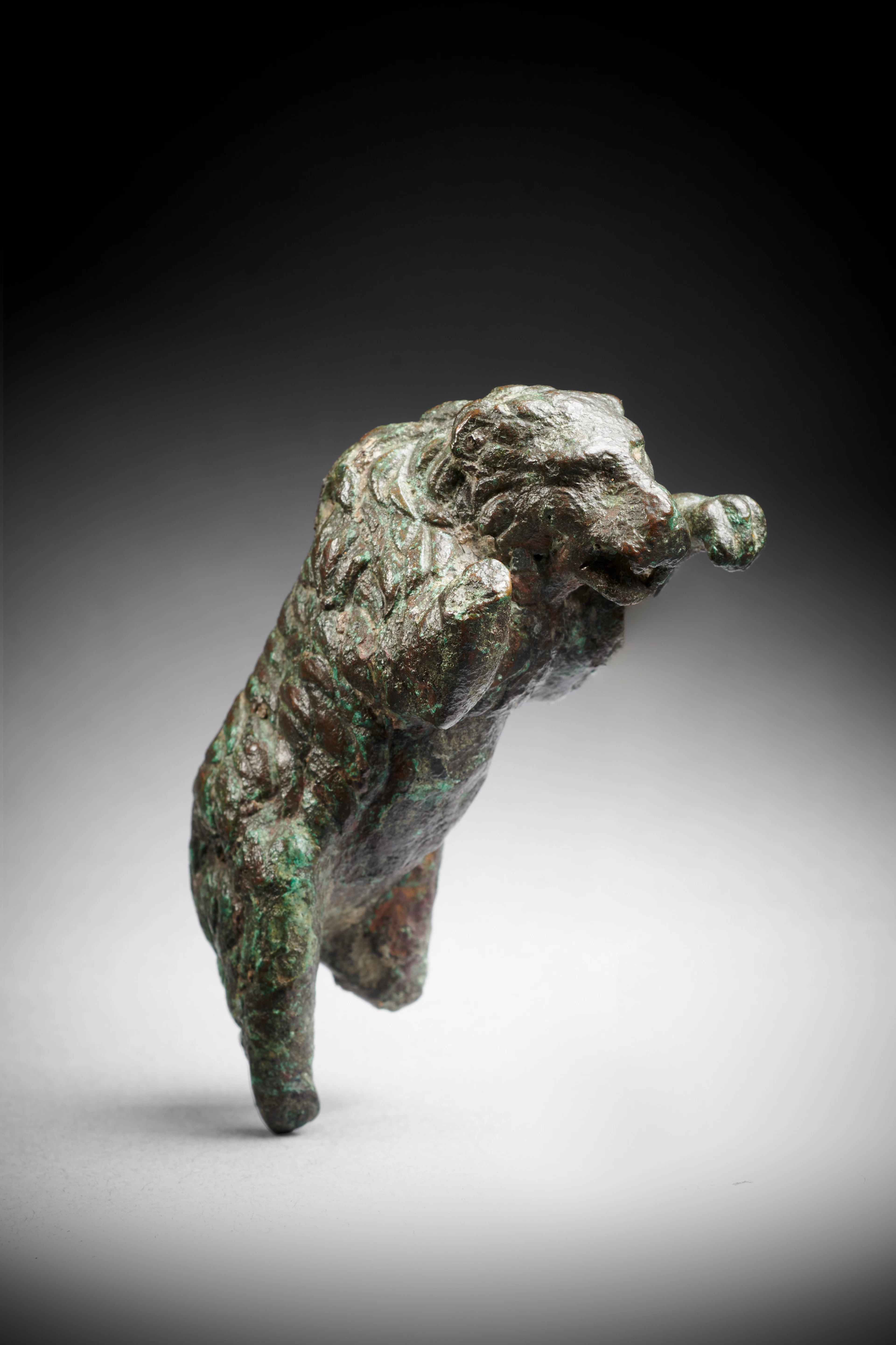 A Roman bronze statuette of a leaping bear, circa 2nd century A.D.