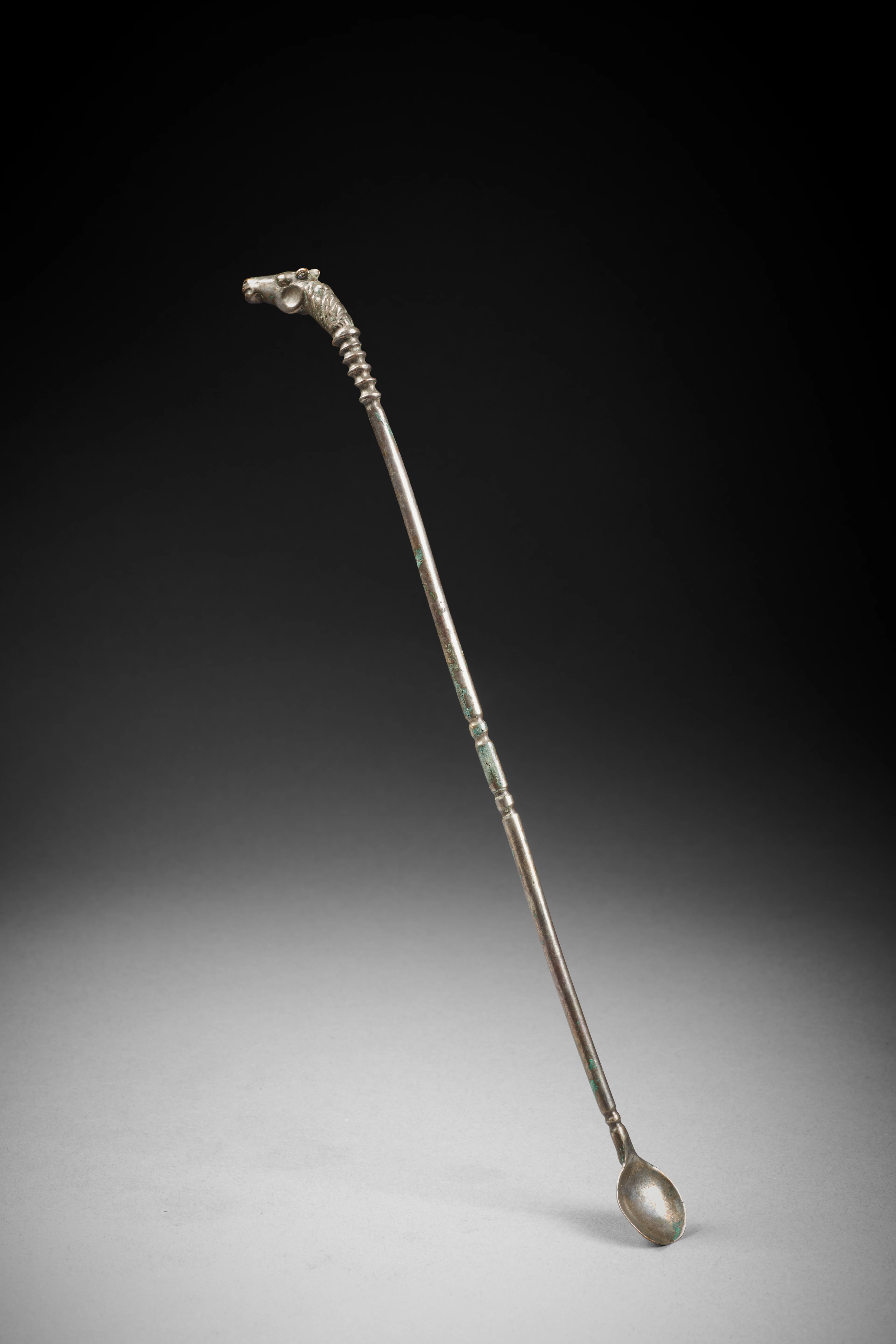 A Hellenistic silver spoon probe with horse head