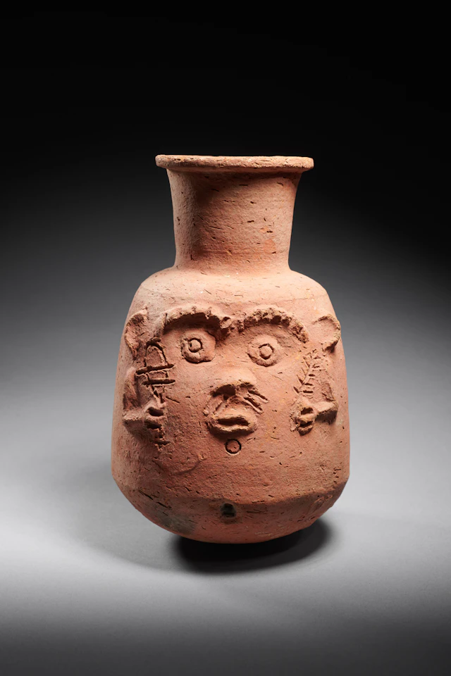 An Egyptian terracota Bes vase